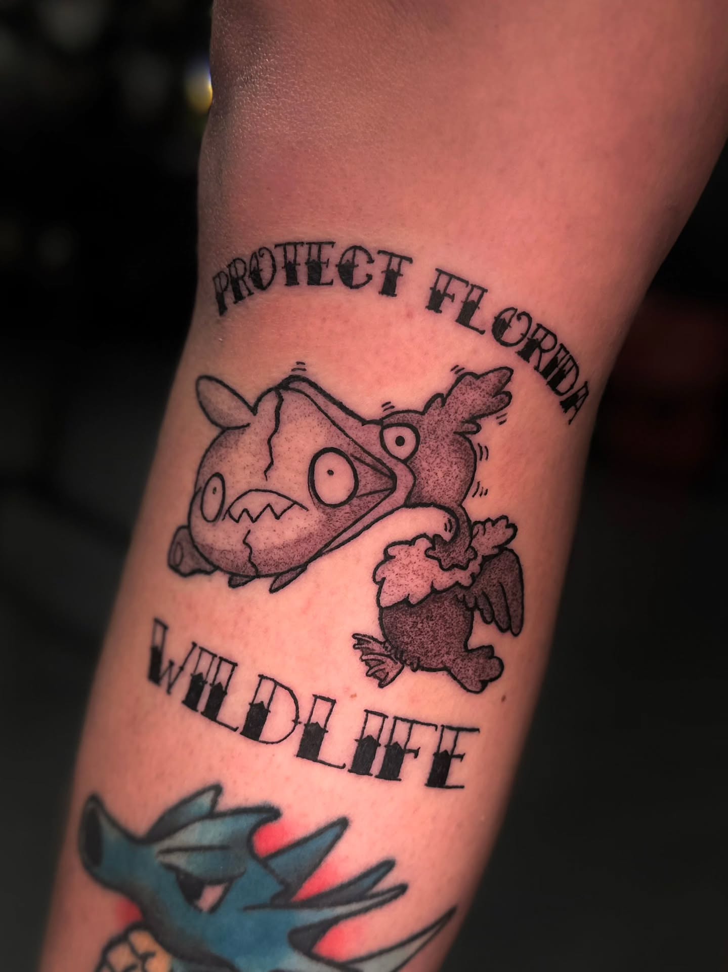 Protect florida wildlife black and grey tattoo on the forearm by Benjamin Frost