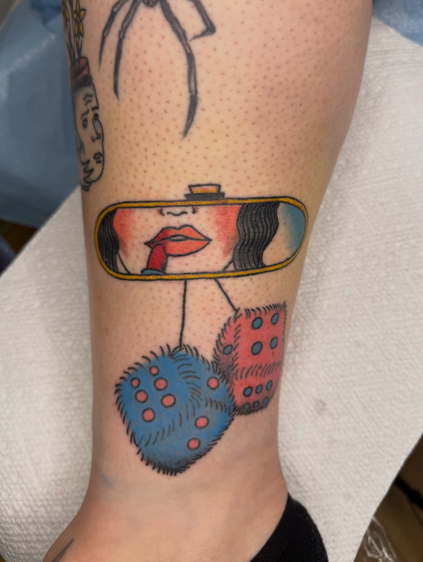 Mirror reflection American traditional tattoo on the forearm by Giana Masso