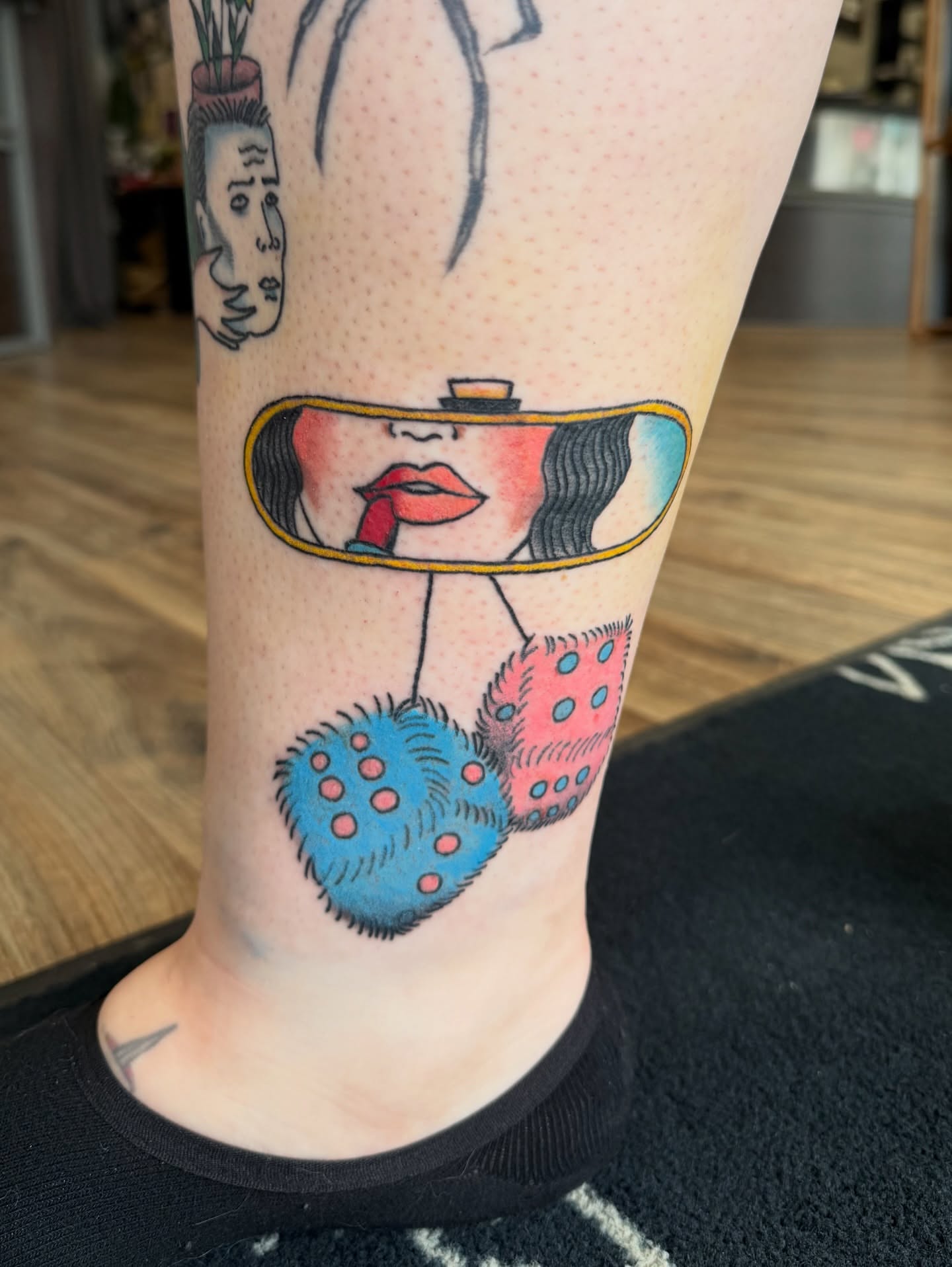 Woman with hat dotwork tattoo on the calf by Giana Masso