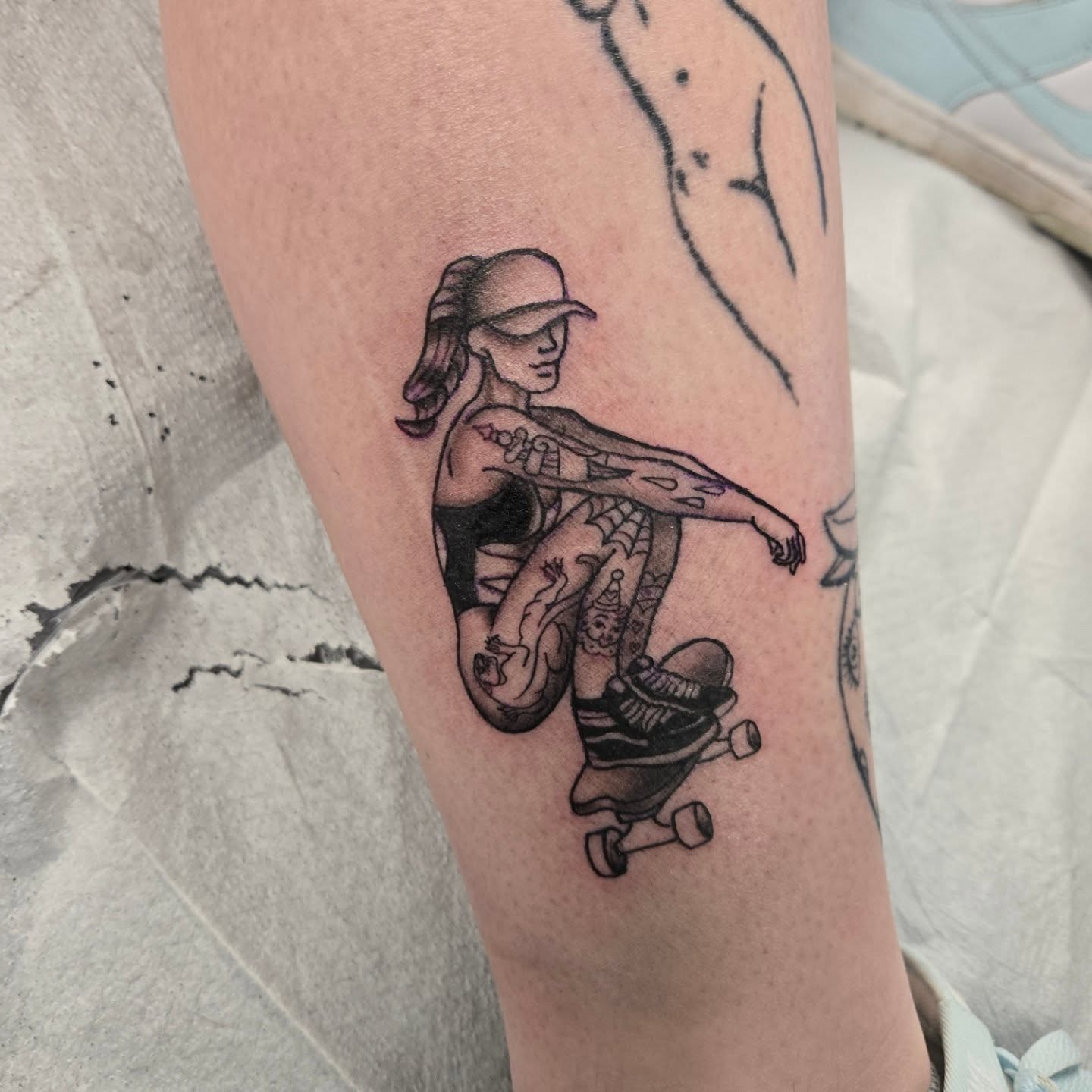 Skateboarding woman black and grey tattoo on the forearm by Jose G. Rubio Tattoo Artist πΊπ²ππ¨π¦