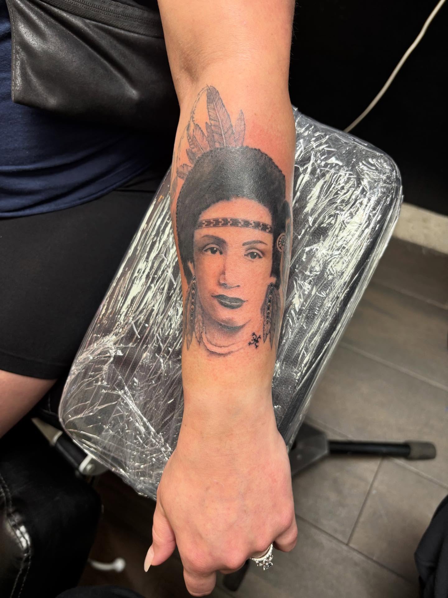 Portrait realism tattoo on the forearm by Christhian King
