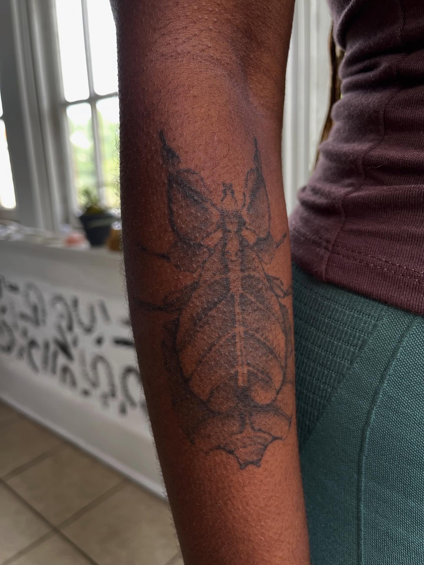 Insect black and grey tattoo on the forearm by Victoria Irula