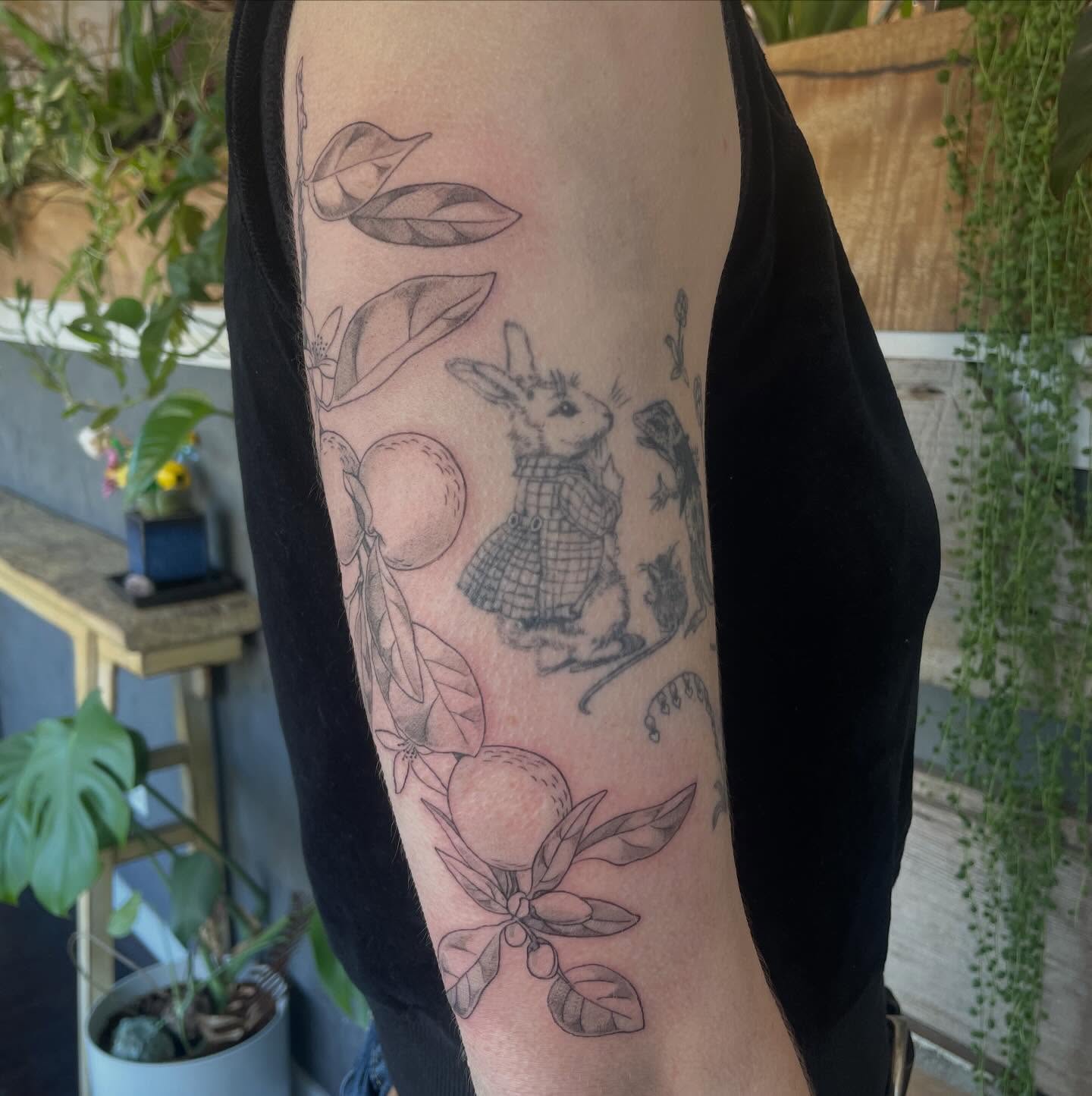 Rabbit and oranges realism tattoo on the forearm by Ally Easter, Berkeley, California