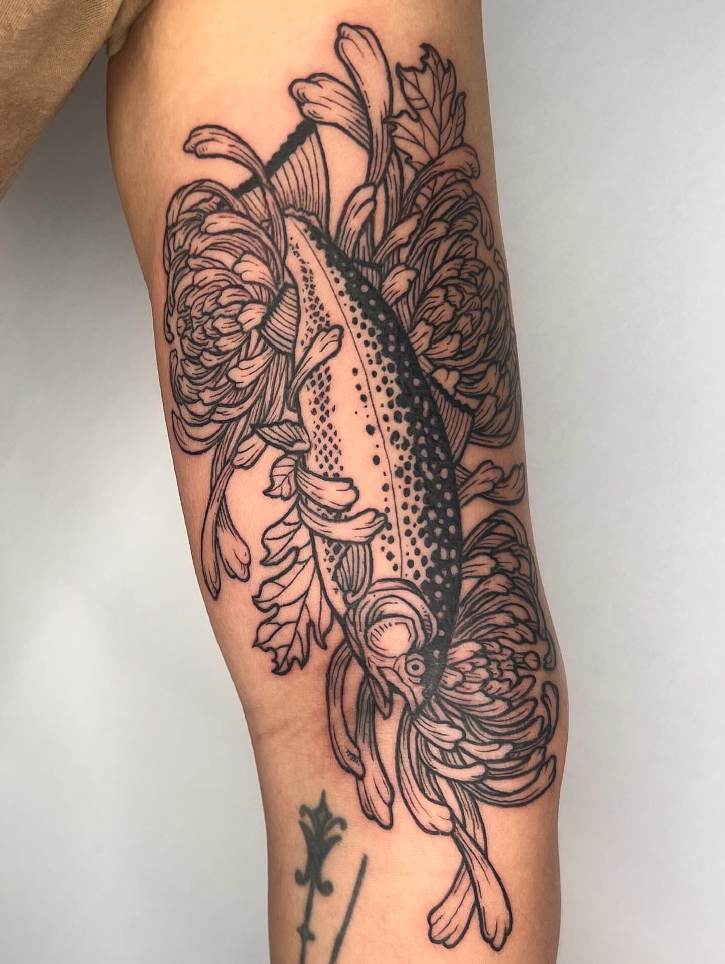 Fish and flowers dotwork tattoo on the forearm by Jason Middelton