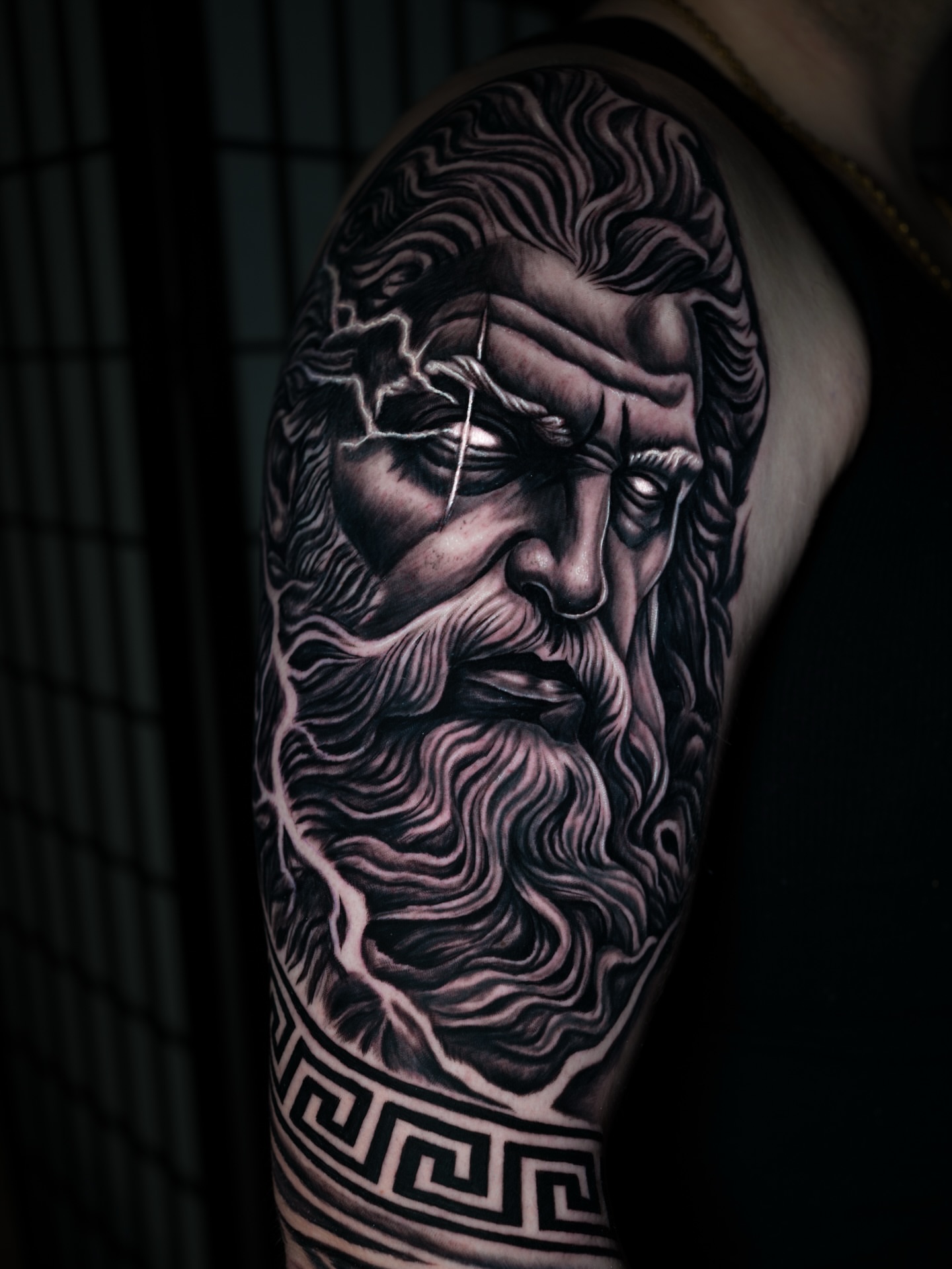 God with lightning bolt realism tattoo on the forearm by Juan David Arias