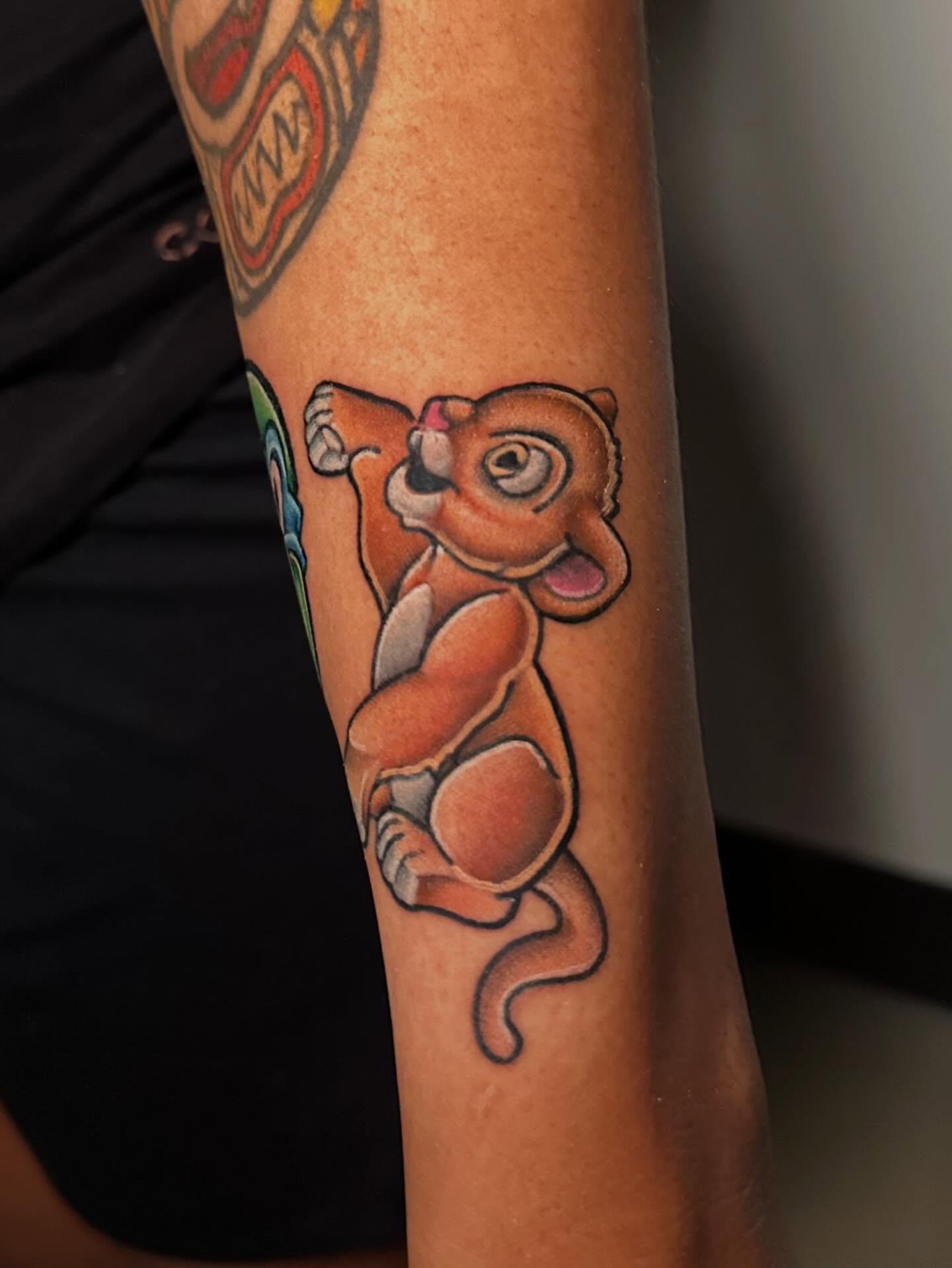 Simba cub American traditional tattoo on the forearm by Chi, Charlotte, North Carolina