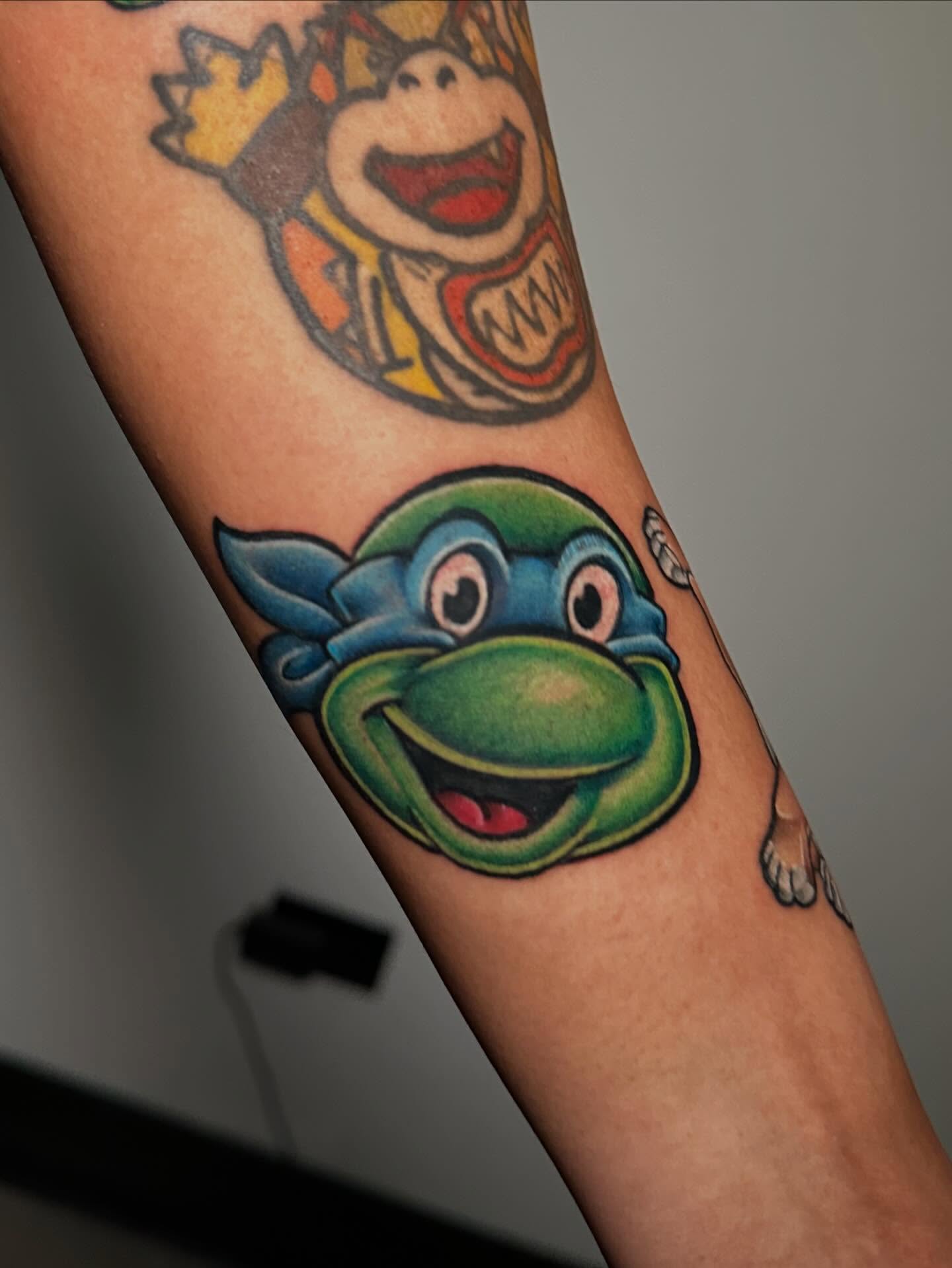 Teenage mutant ninja turtle American traditional tattoo on the forearm by Chi, Charlotte, North Carolina