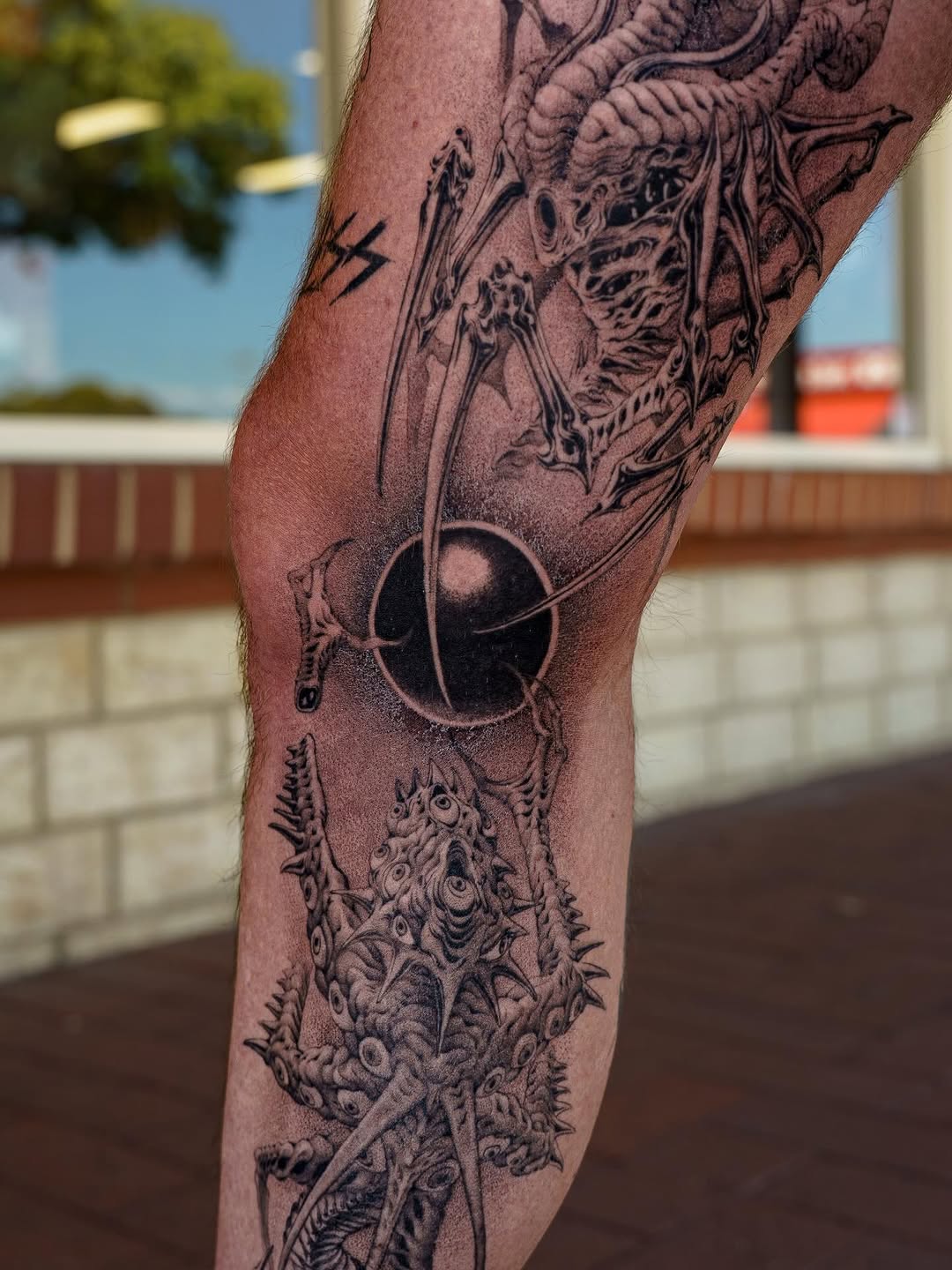Tattoo by @nowthisyujhi — black_and_grey, dark_realism