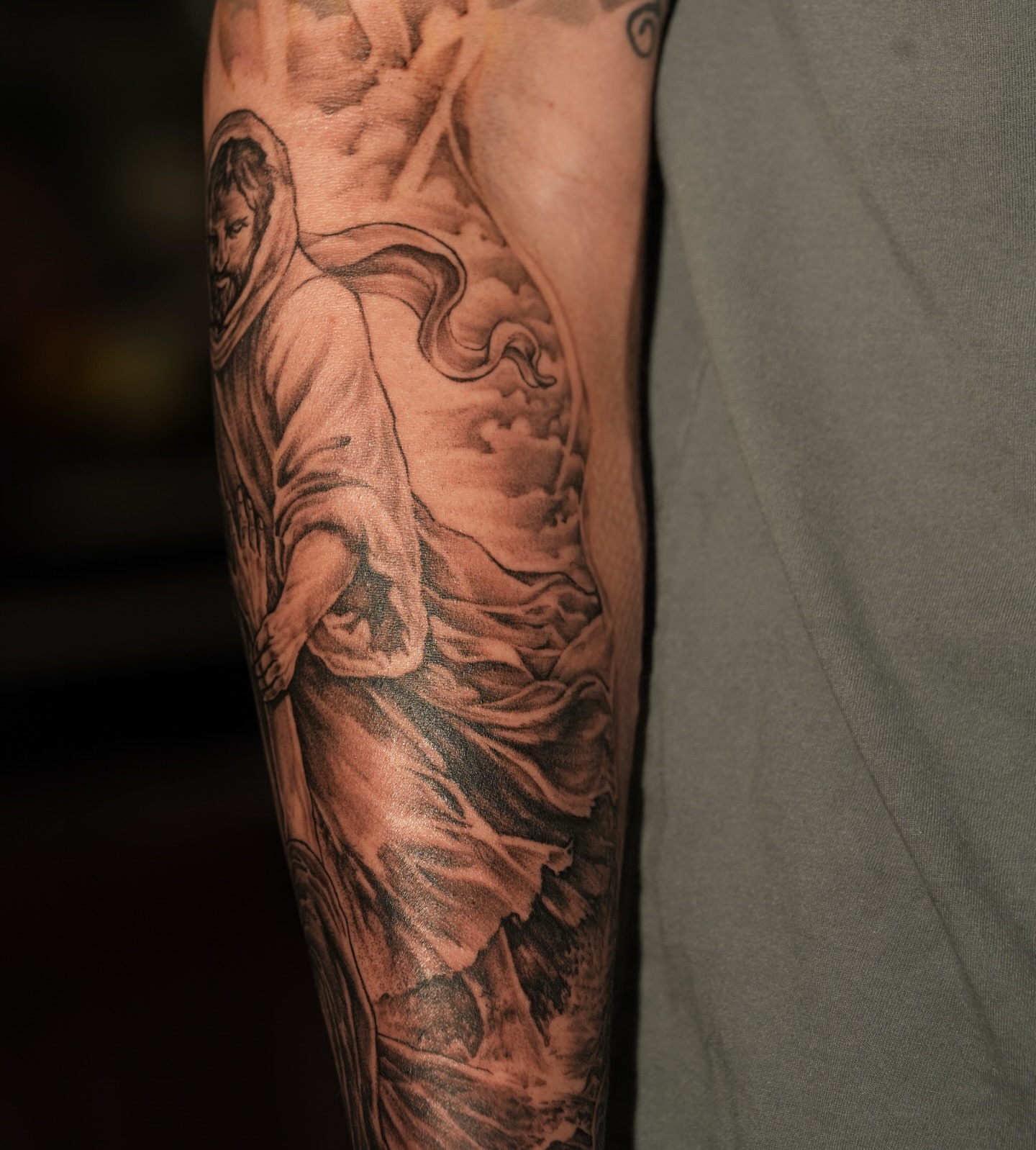 Religious figure black and grey tattoo on the forearm by Kevin Betancourt