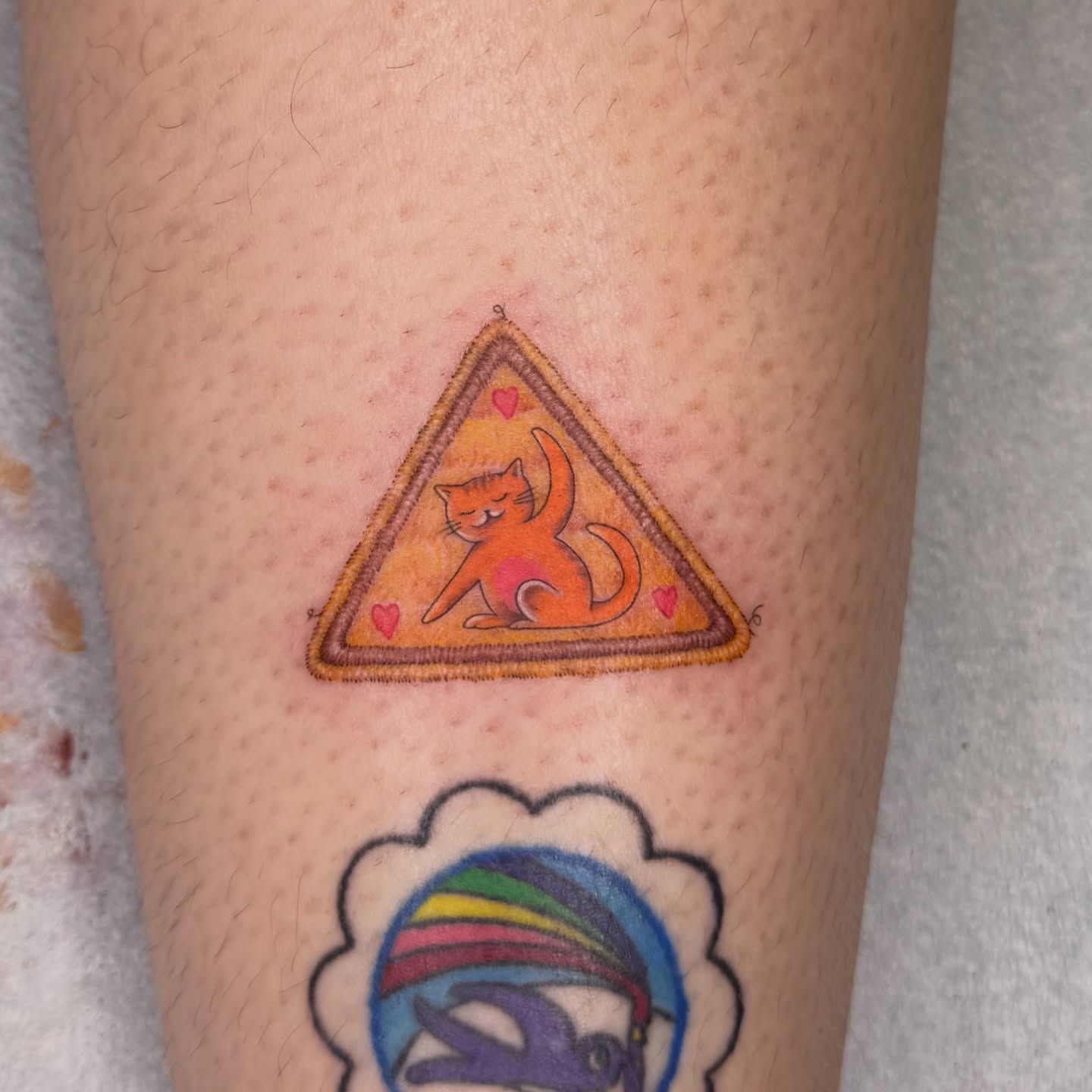 Cat in triangle geometric tattoo on the forearm by Fabian💉 Tattoo artist