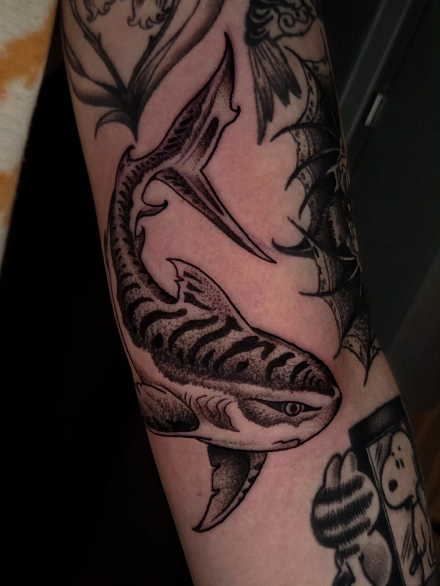 Shark black and grey tattoo on the forearm by Ian Kiser