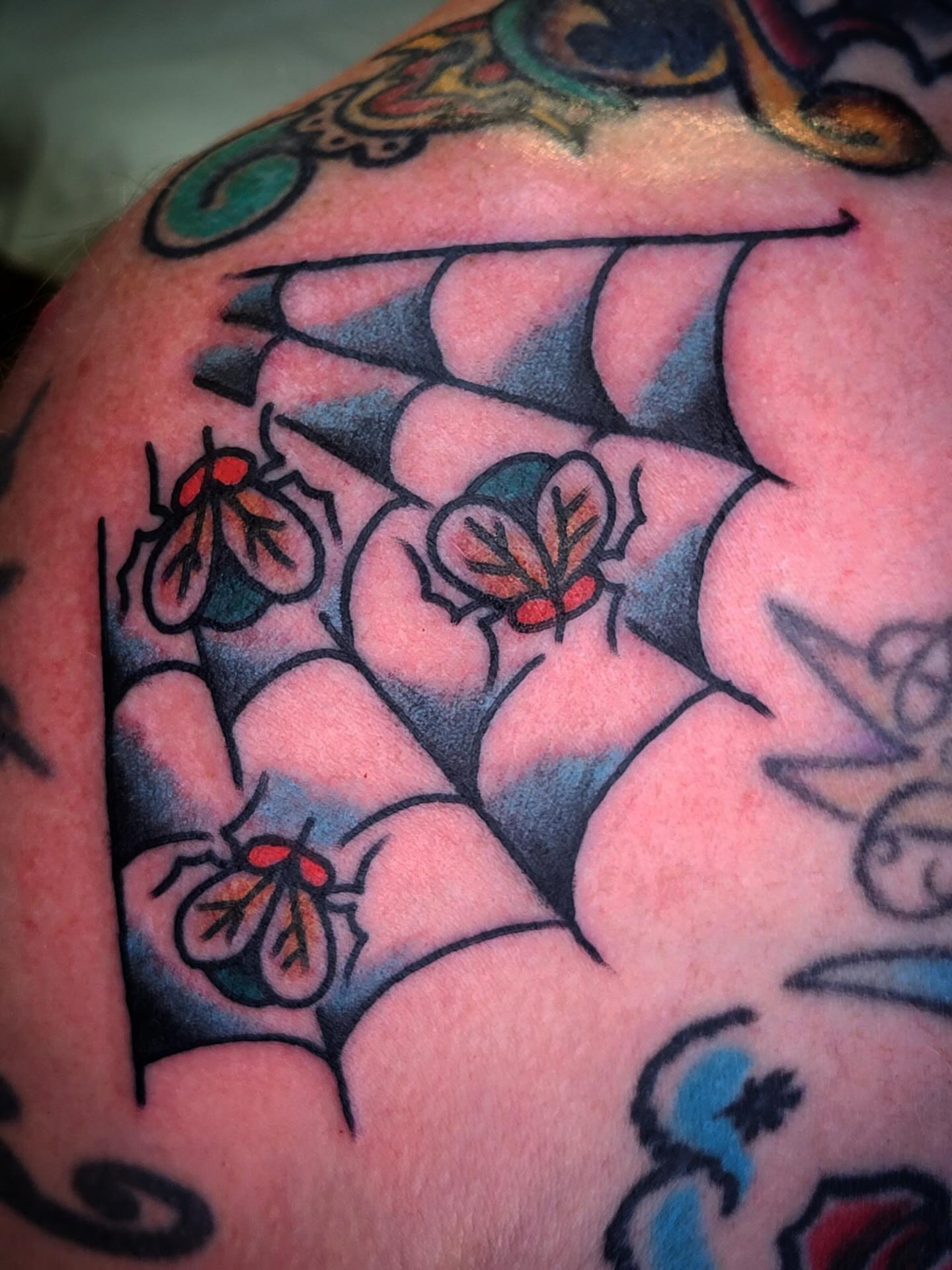 Spider web with insects American traditional tattoo on the shoulder by joe martinez, Denver, Colorado