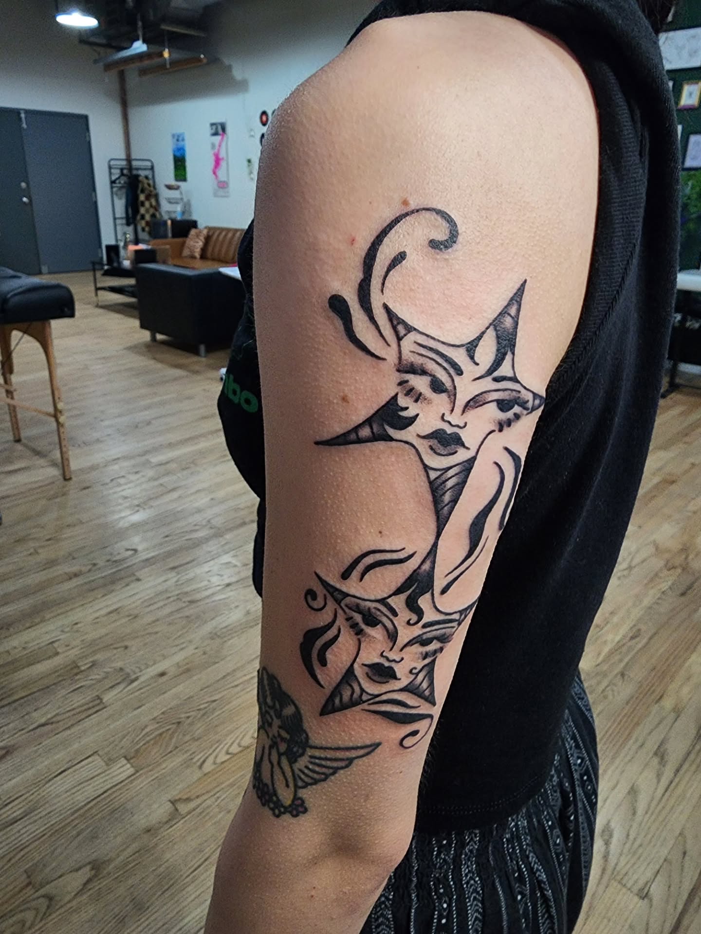 Mermaid American traditional tattoo on the upper arm by Maxine Stewart