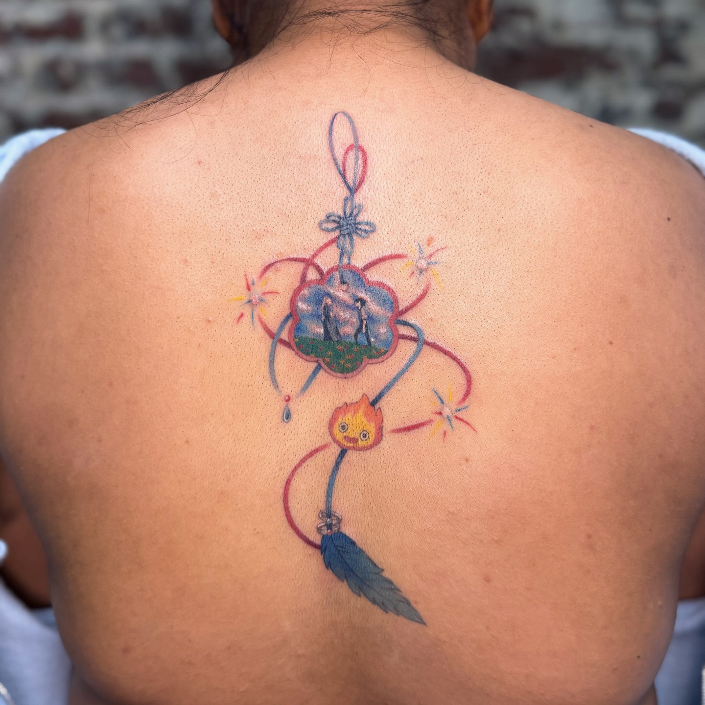 Dreamcatcher illustrative tattoo on the back by justin
