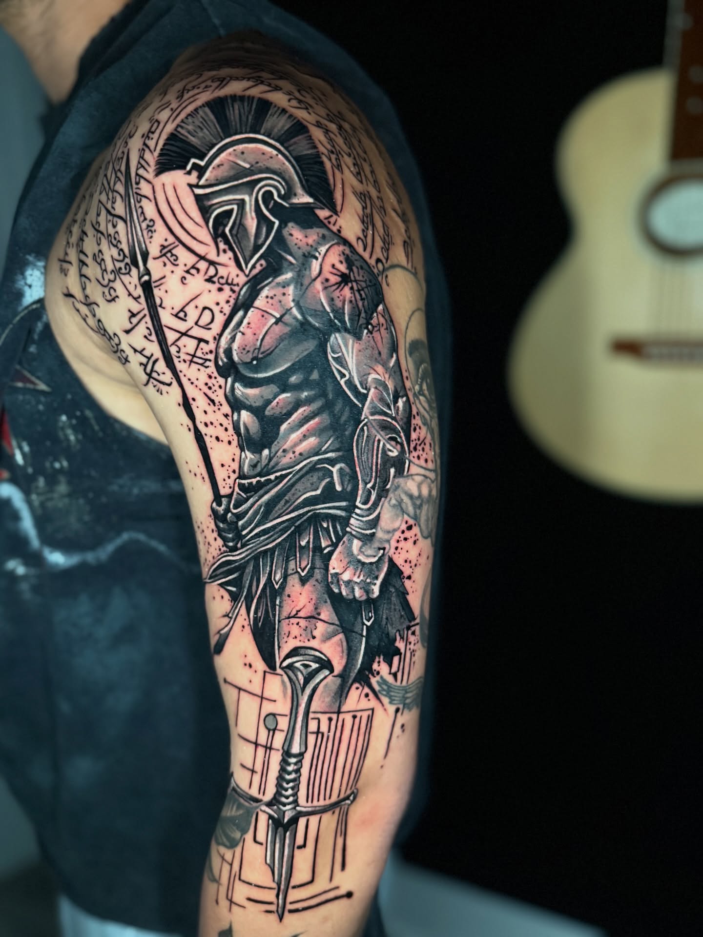Spartan warrior dotwork tattoo on the upper arm by Yanko Reyes