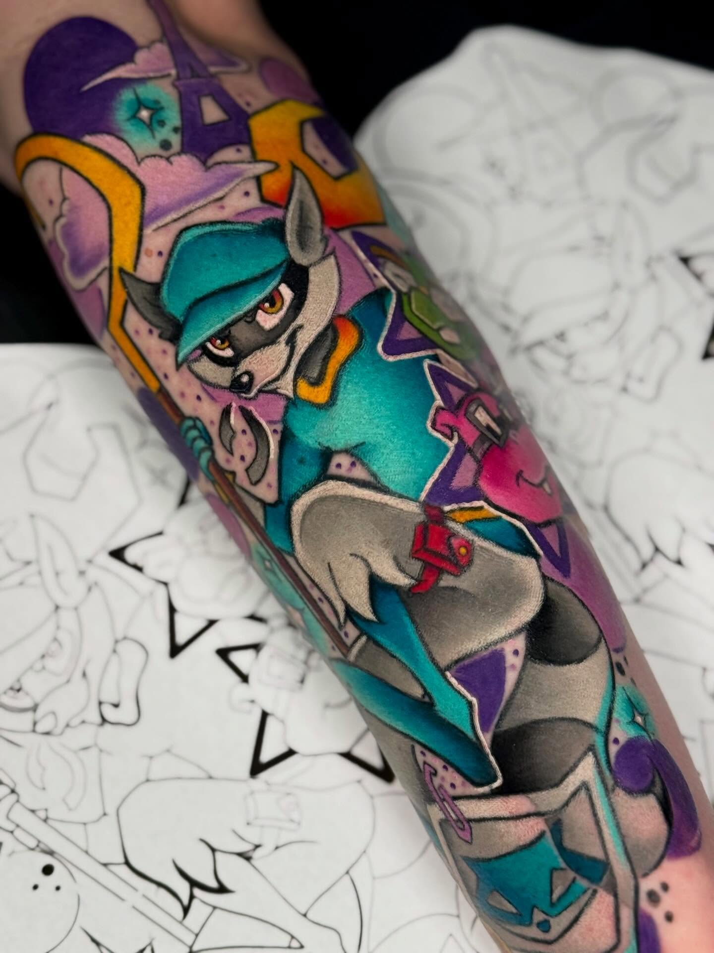 Raccoon character new school tattoo on the forearm by Brianna Dickson