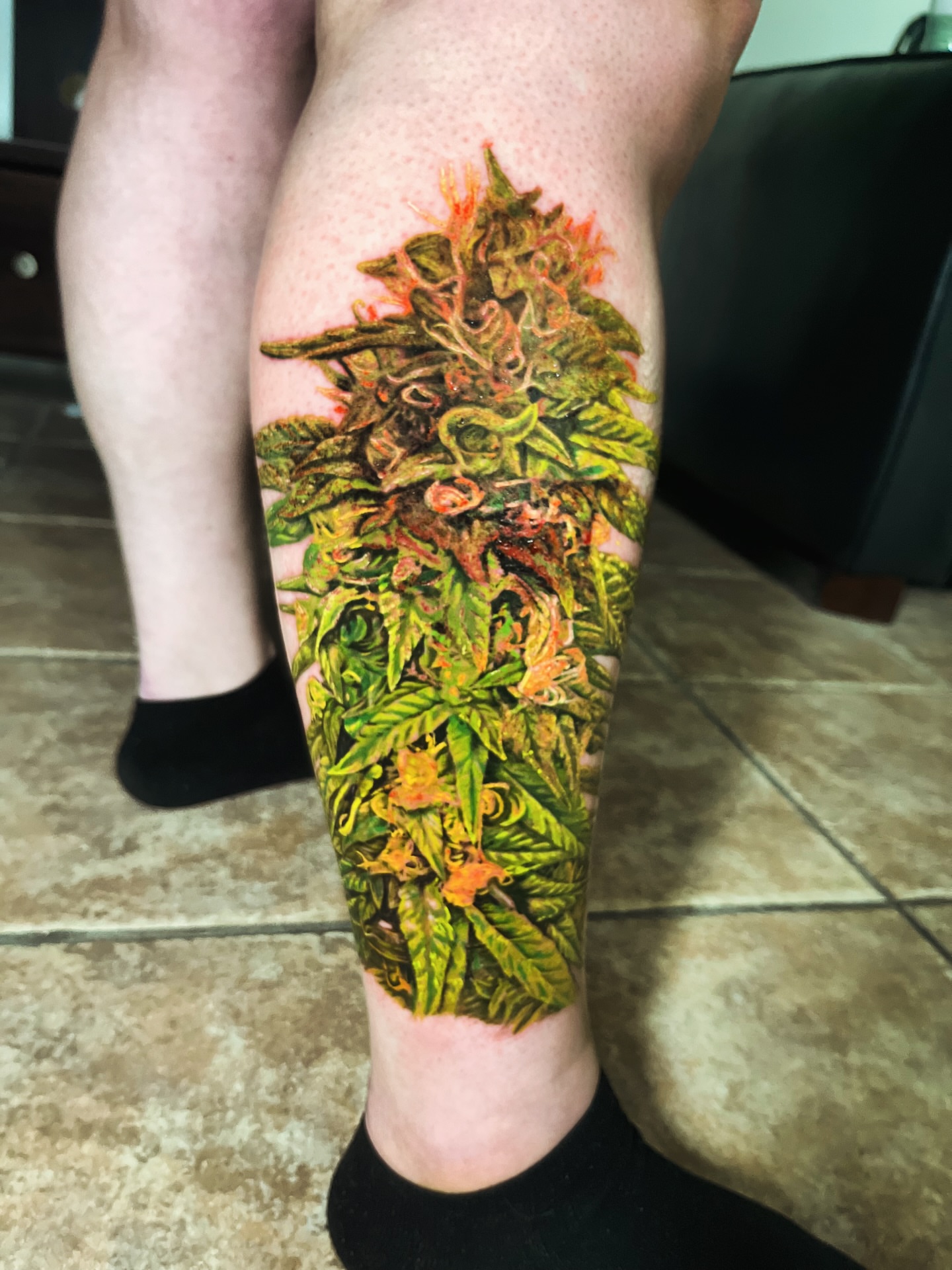 Marijuana plant realism tattoo on the calf by Elijah Tattoos, San Diego, California