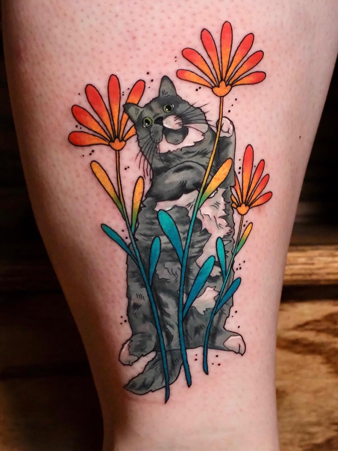 Cat among flowers realism tattoo on the thigh by Mallory Murphy, Denton, Texas