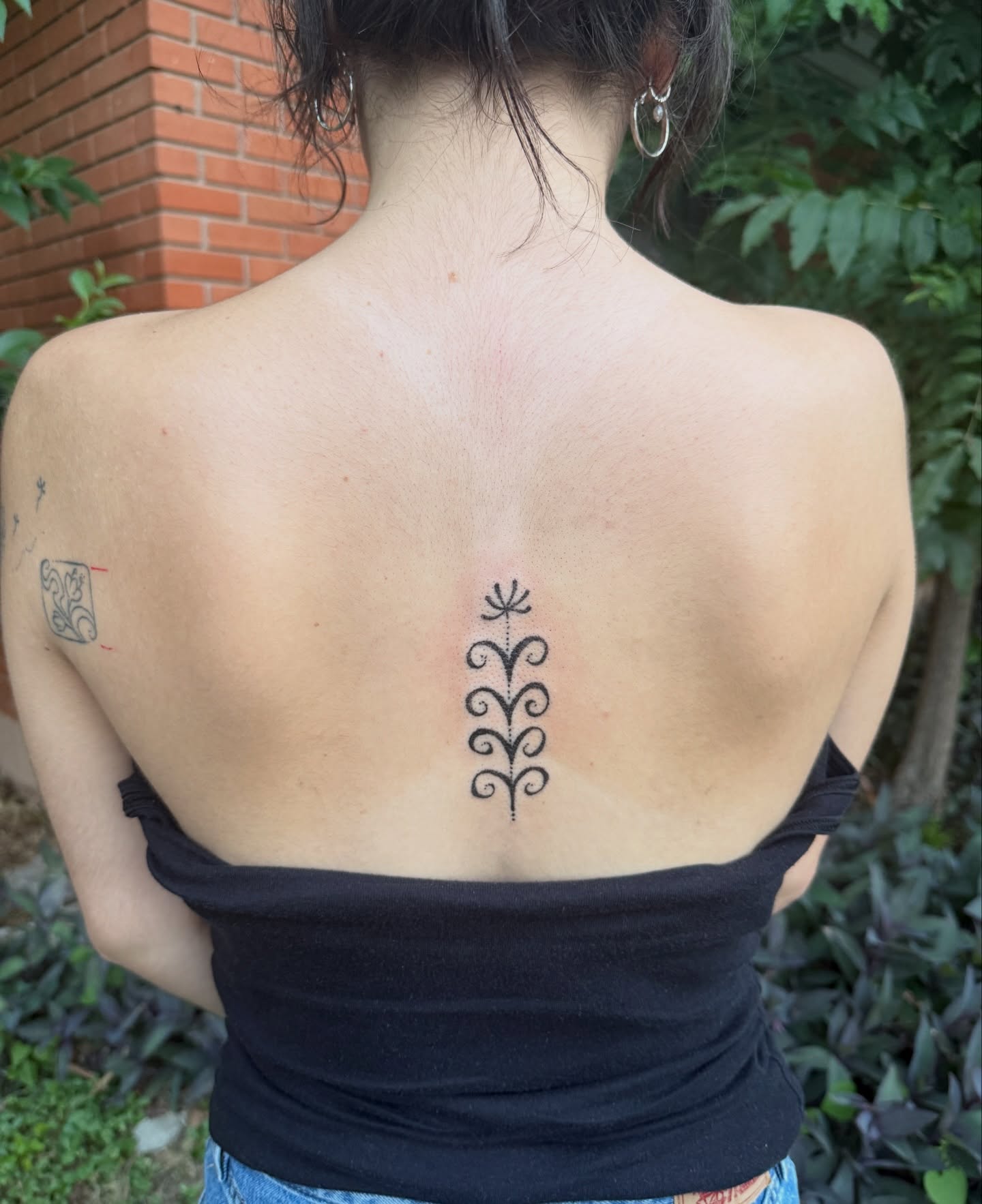 Floral pattern geometric tattoo on the back by springgreens