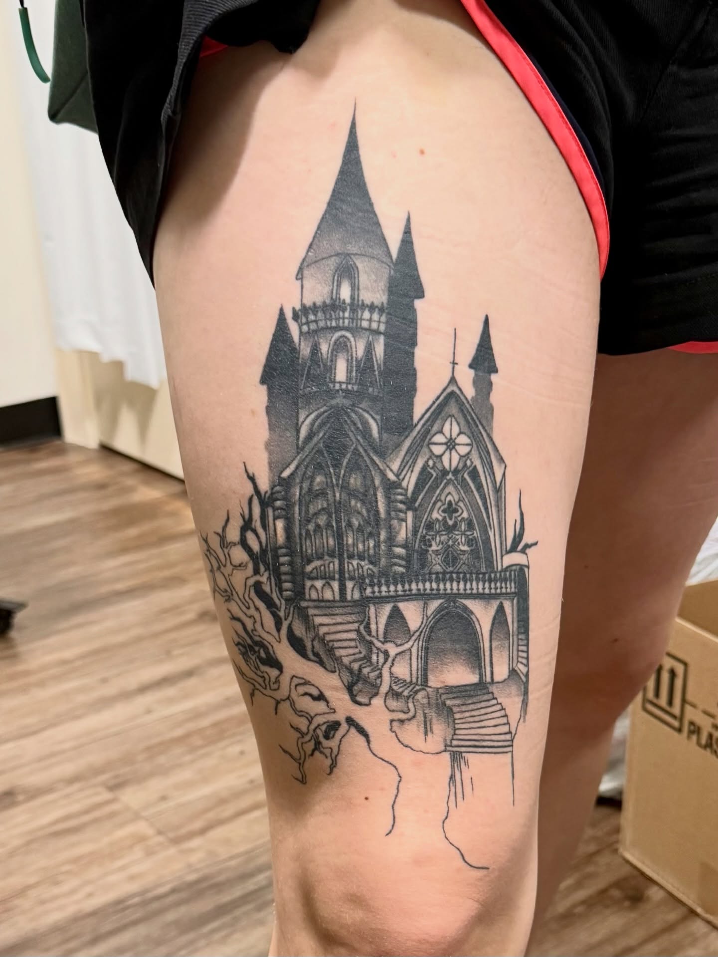 Gothic cathedral black and grey tattoo on the thigh by Tatum