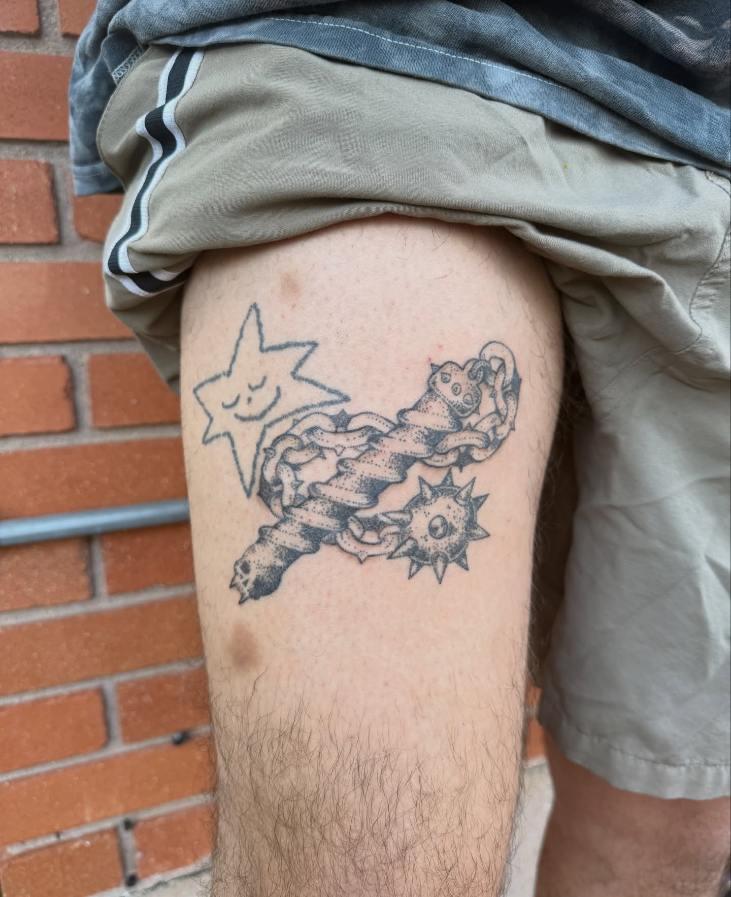 Star and ribbon dotwork tattoo on the thigh by springgreens