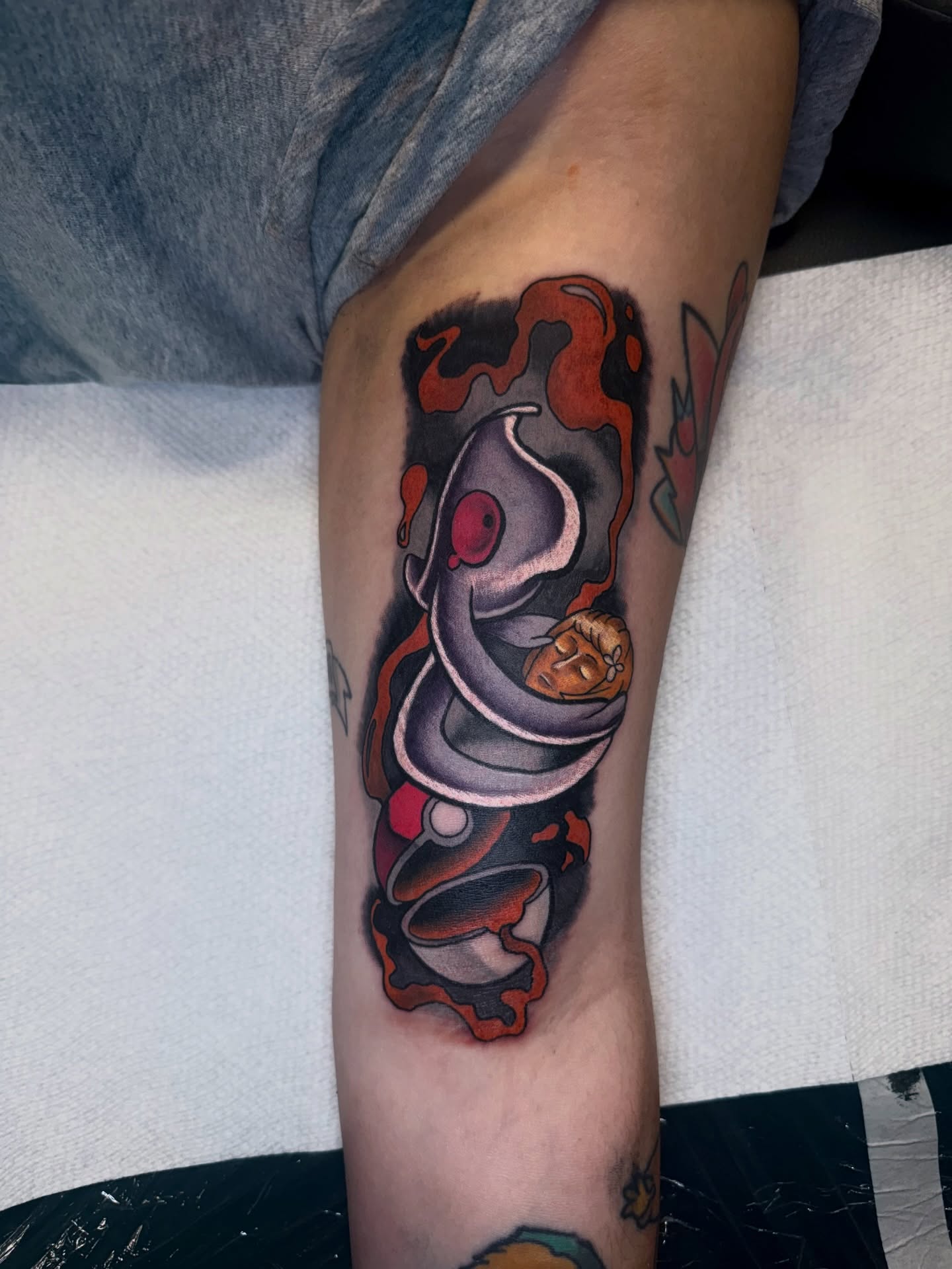 Astronaut in space new school tattoo on the forearm by Ben McKee
