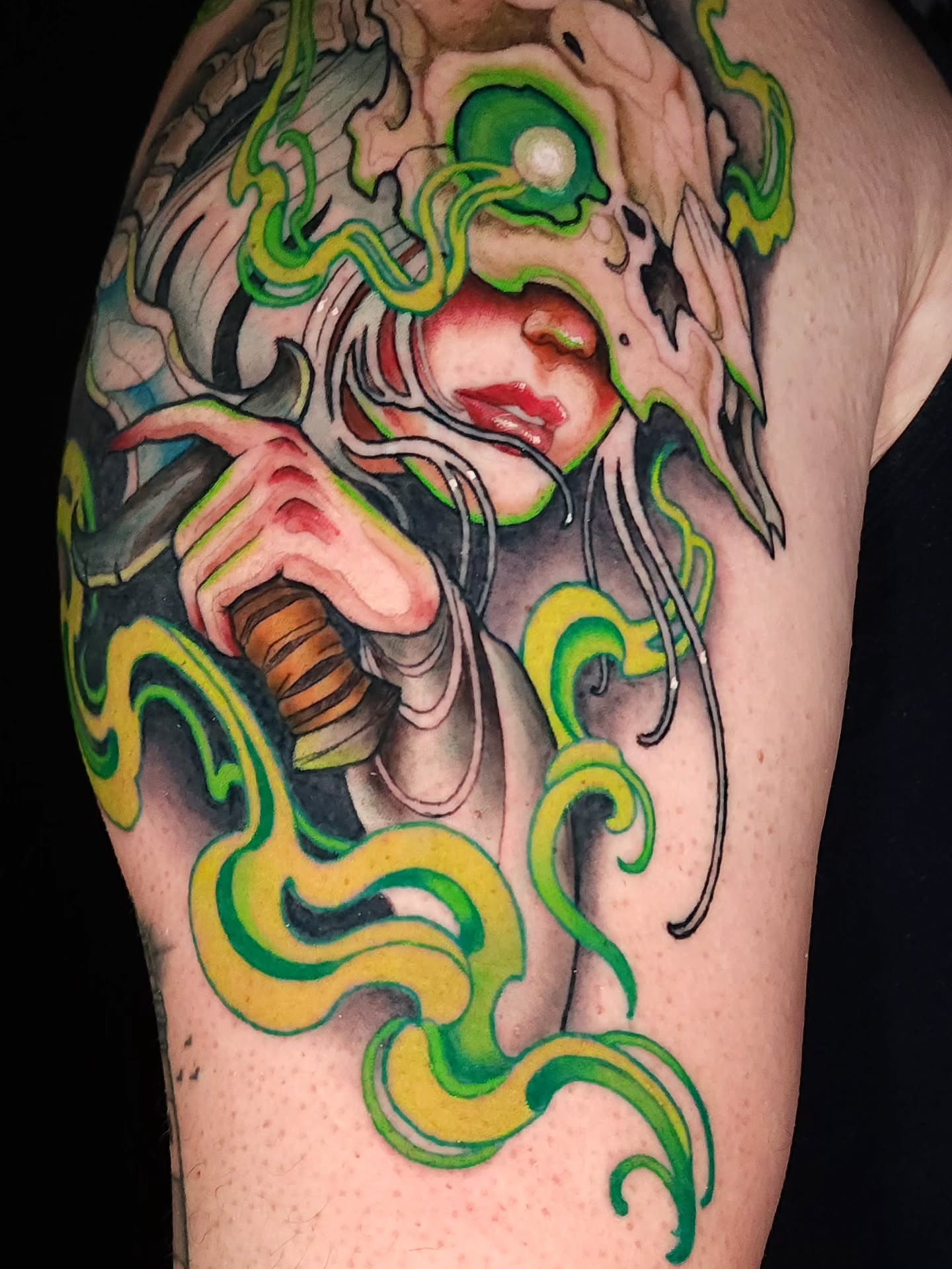 Woman with tentacles illustrative tattoo on the shoulder by Mario Romero