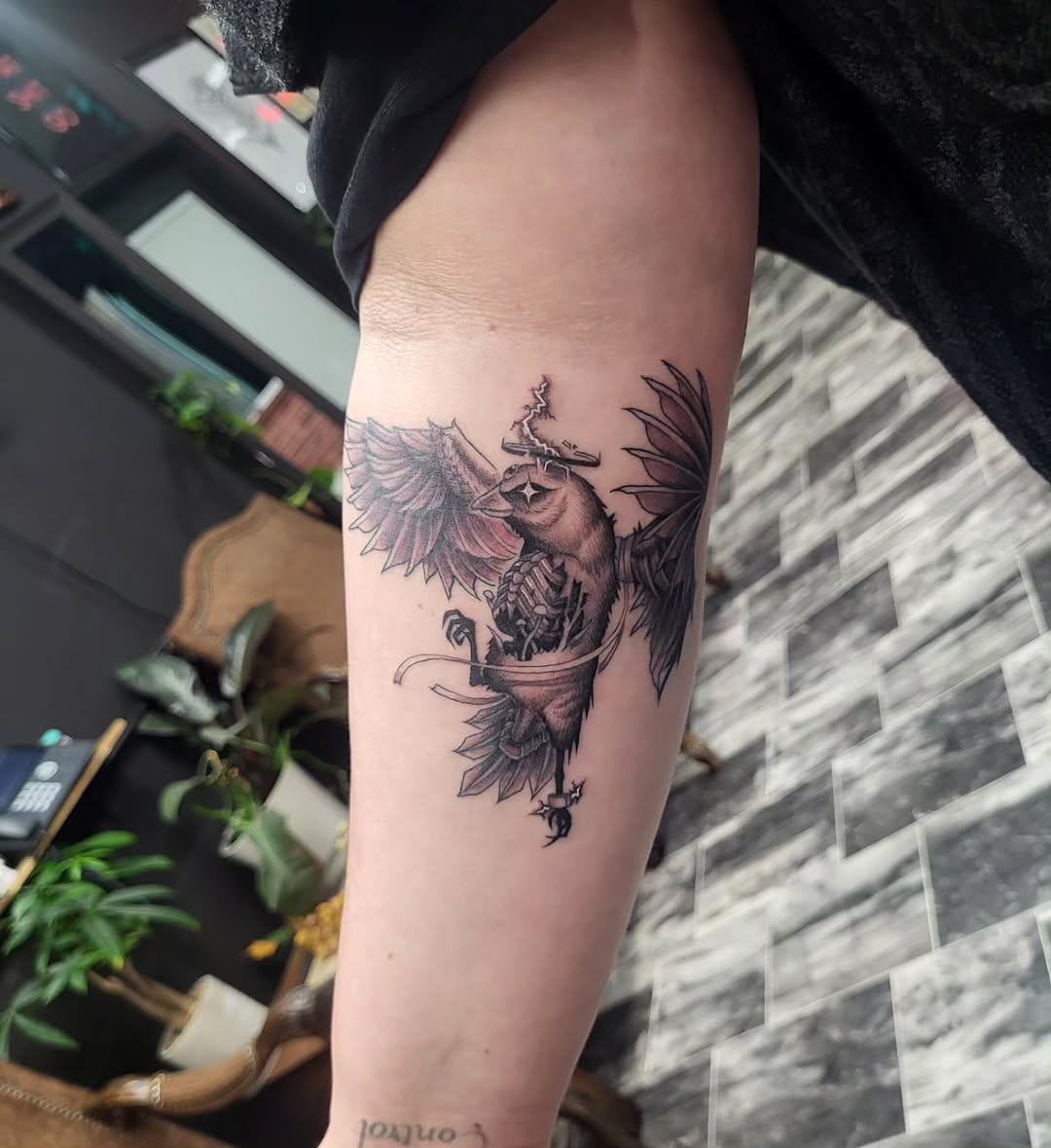 Bird with skeleton inside fine line tattoo on the forearm by TEA ☕️ Tattoos