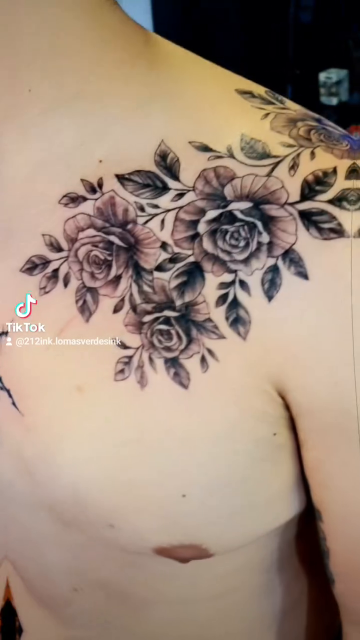 Roses and abstract symbol neo-traditional tattoo on the chest by Tatuajes Betto Ink Tattoo