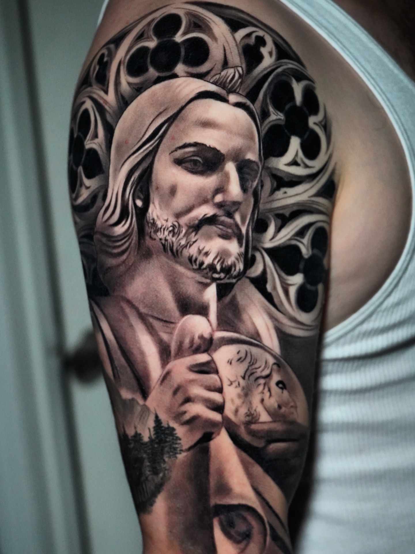 Religious figure realism tattoo on the forearm by Elijah Tattoos, San Diego, California