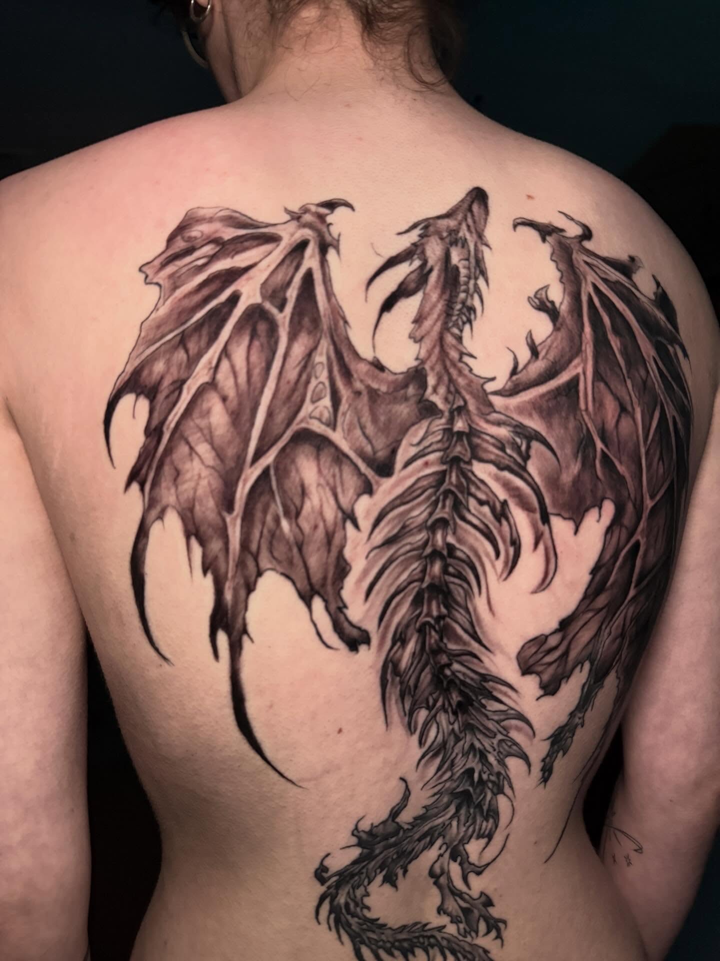 Dragon black and grey tattoo on the back by Lucky Valenzuela, Lakewood, Colorado