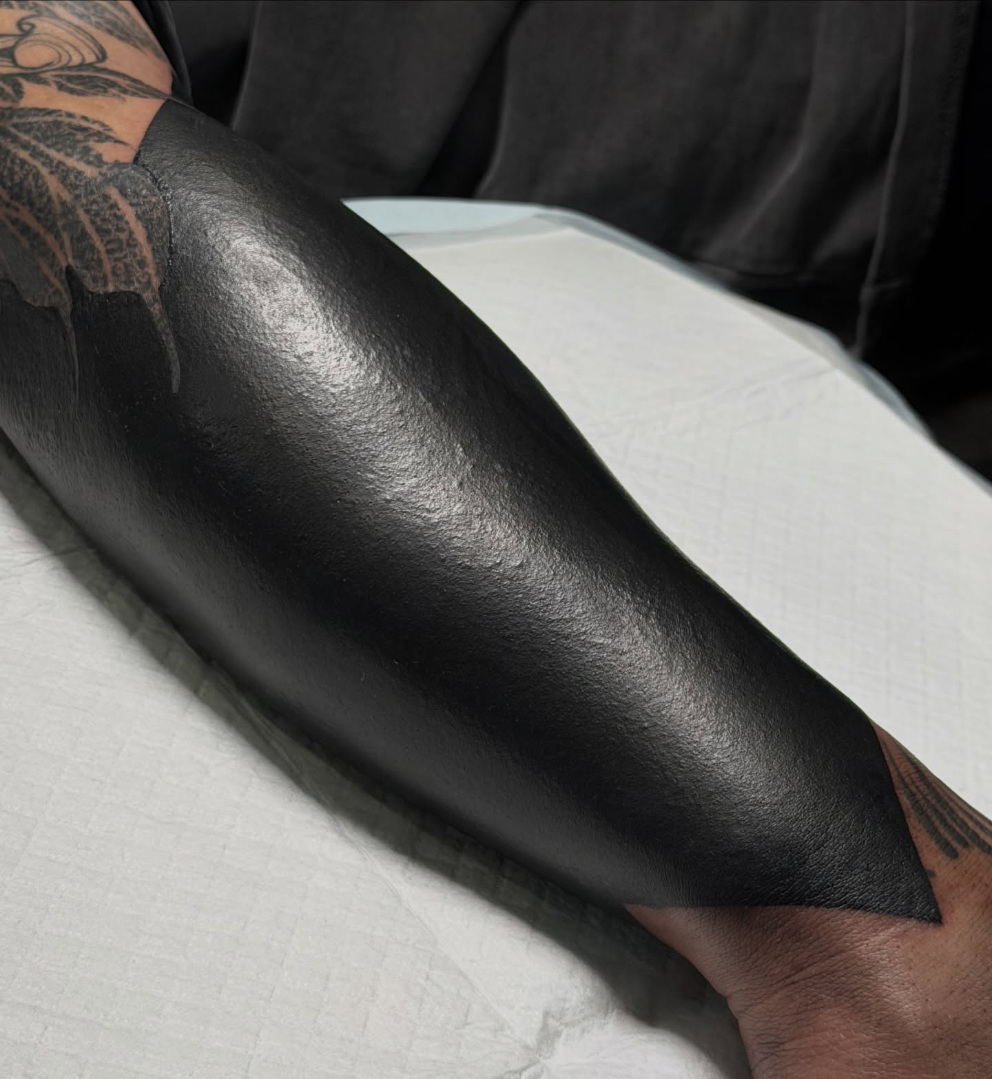 Black gradient black and grey tattoo on the forearm by Zlata