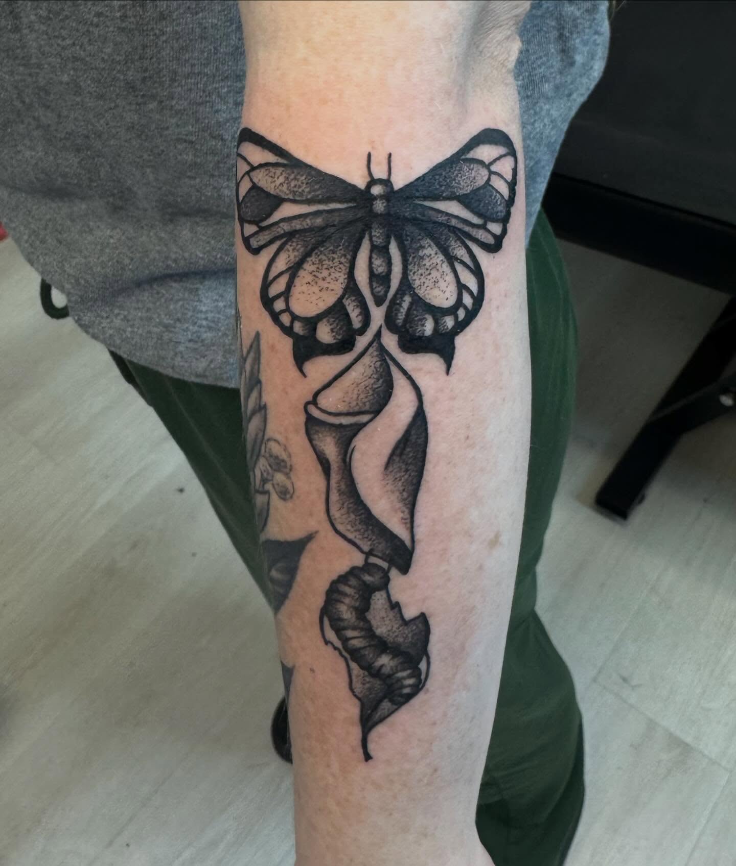 Butterfly black and grey tattoo on the forearm by Gigi