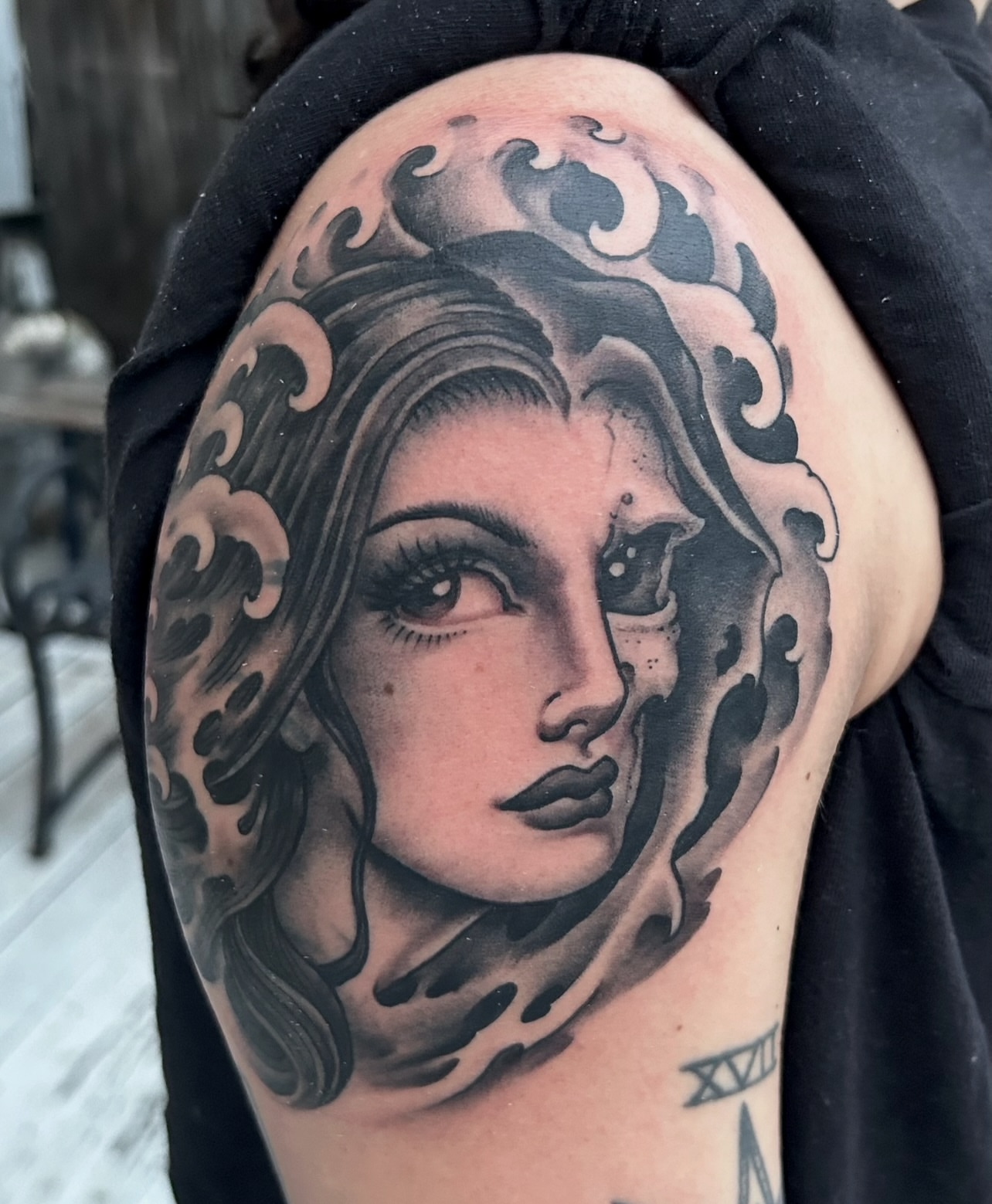 Woman's face realism tattoo on the shoulder by Justin Weatherholtz, New York, New York