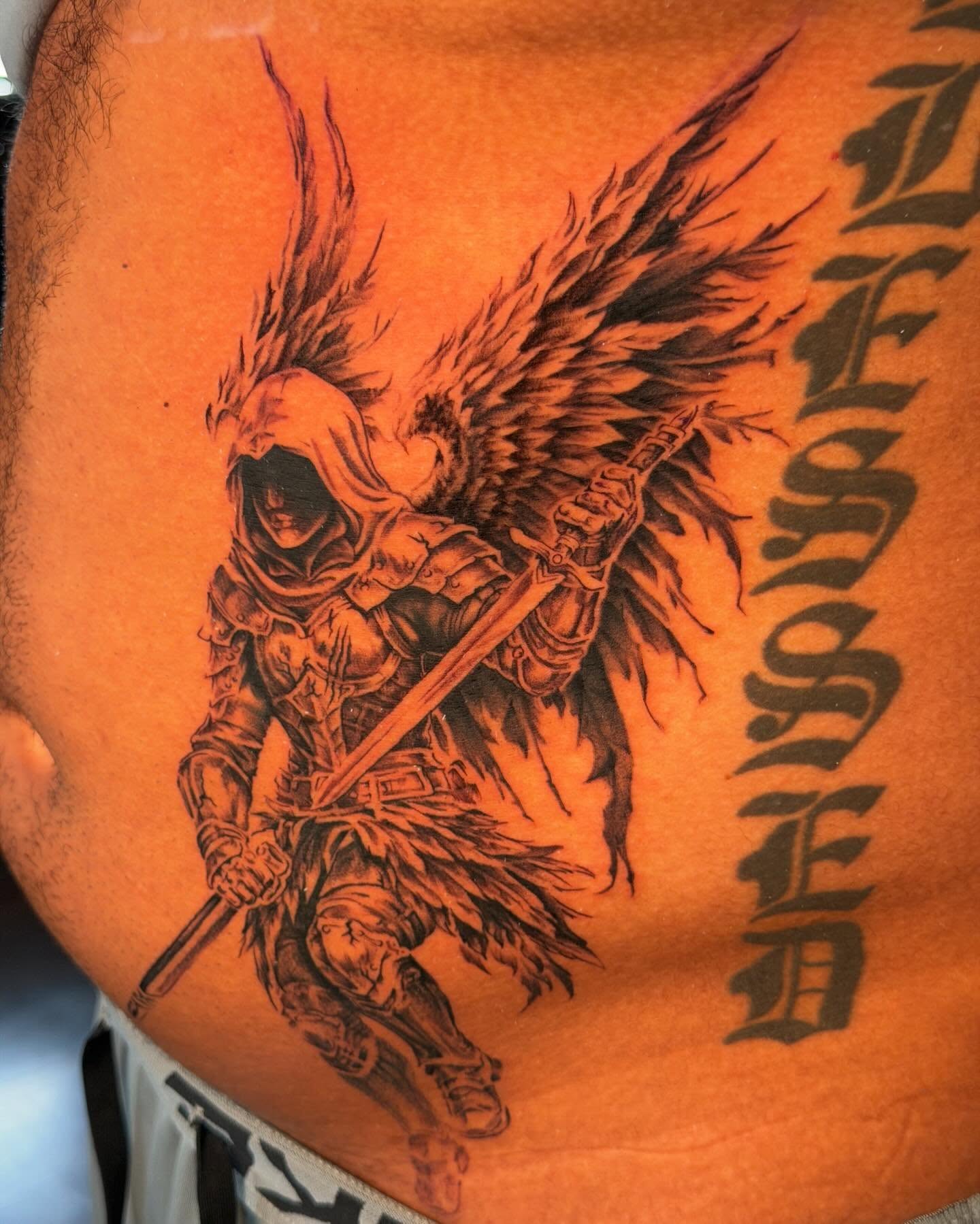 Warrior with wings dark realism tattoo on the thigh by James Nelson