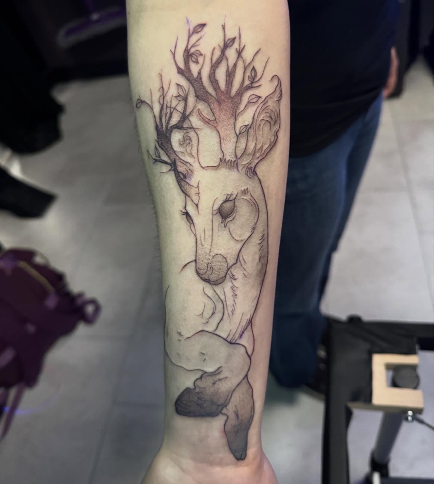 Deer black and grey tattoo on the forearm by Lindsay