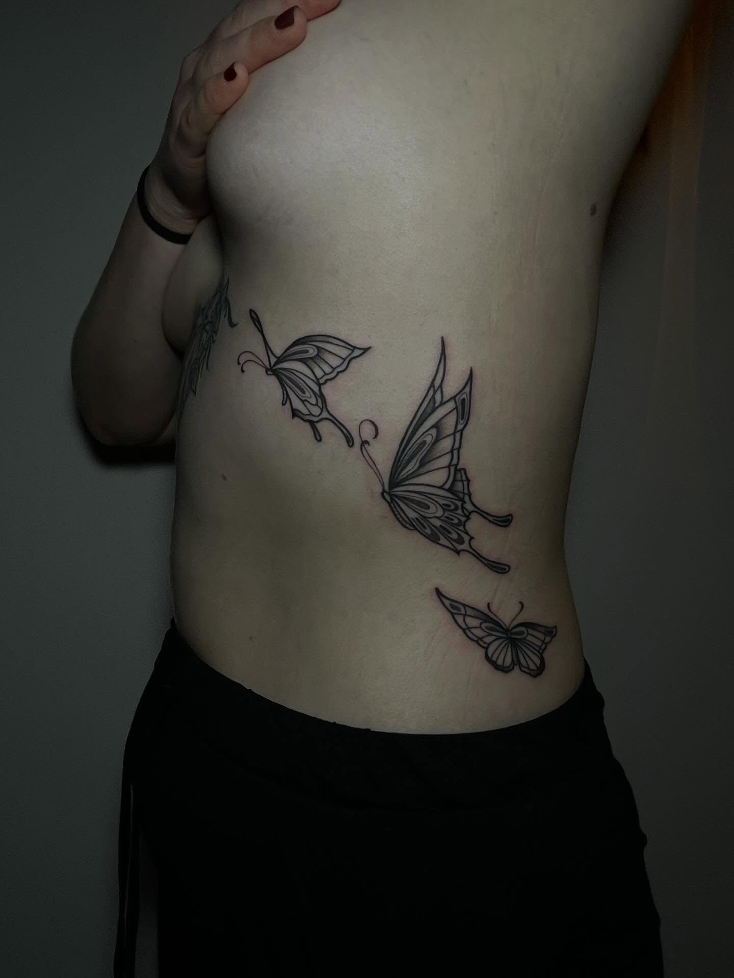 Butterflies black and grey tattoo on the ribs by Danika Brooke 🧿