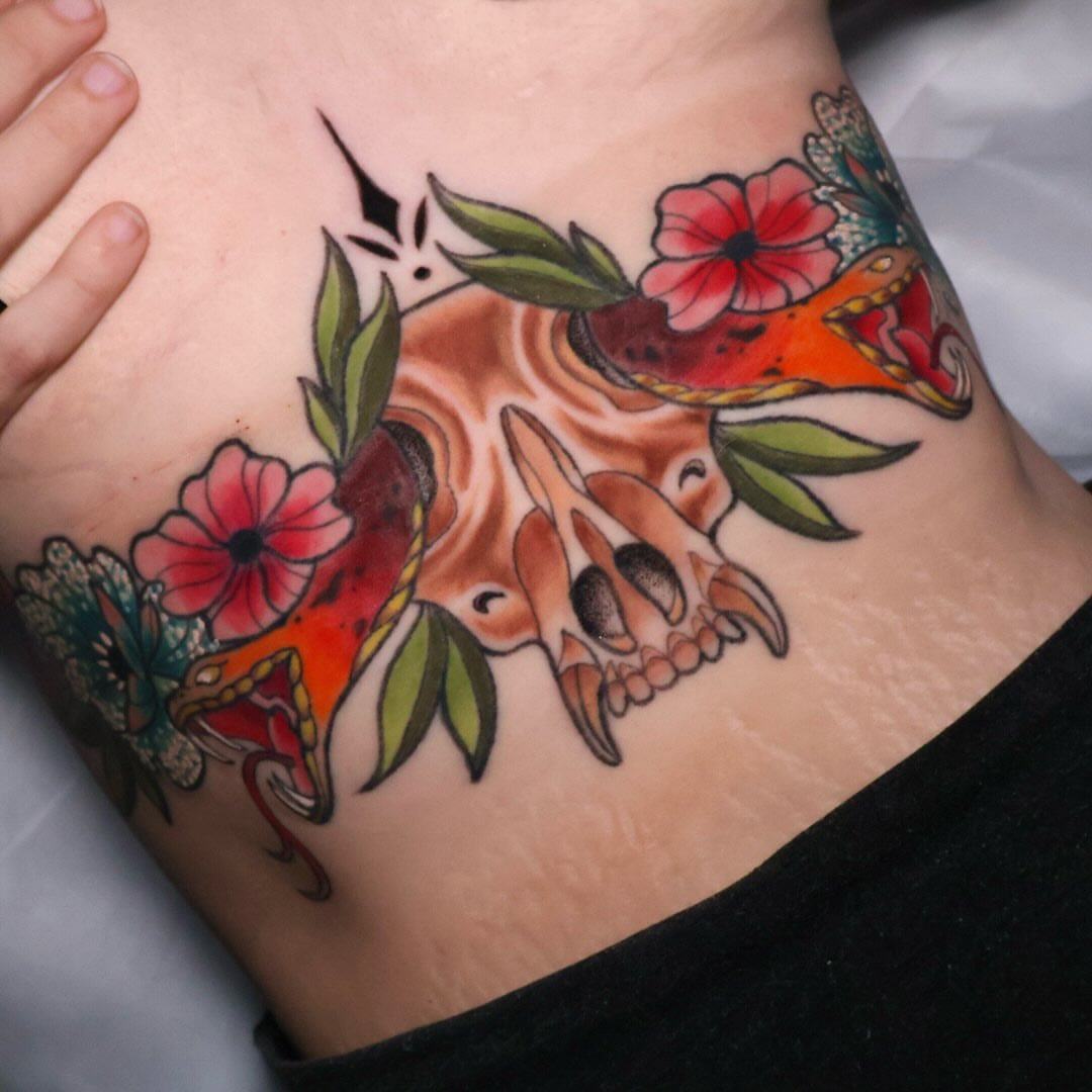 Skull and koi fish American traditional tattoo on the ribs by Bailey Drey