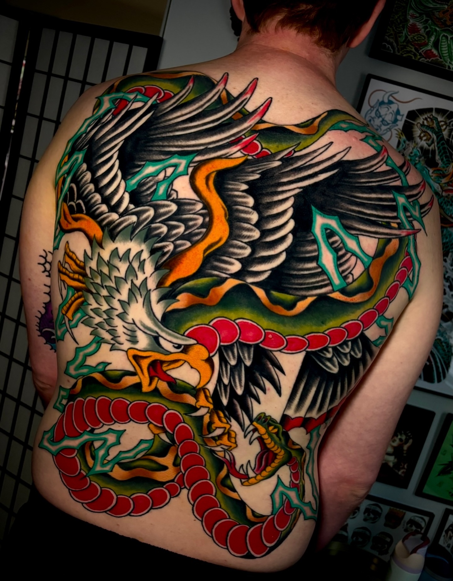 Dragon and phoenix American traditional tattoo on the back by Mickey Putillo, Charlotte, North Carolina