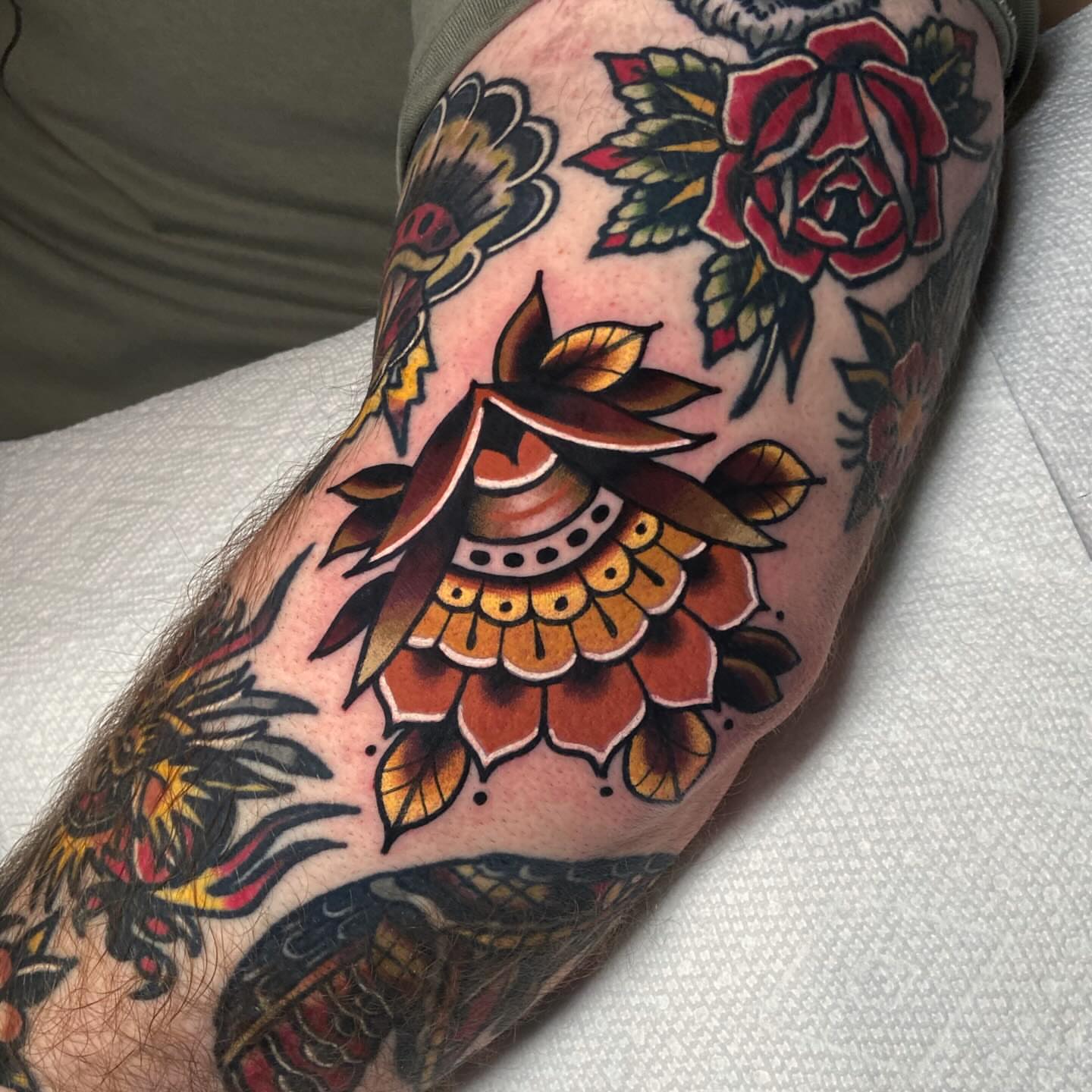 Floral design American traditional tattoo on the forearm by Matthew Limbers⚜️