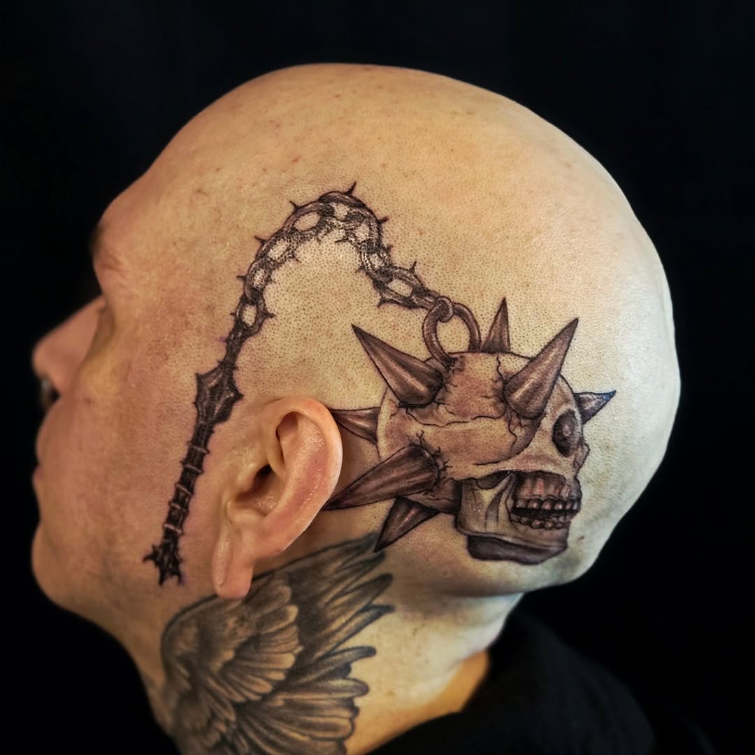 Skull flail realism tattoo on the head by Tim Andrews