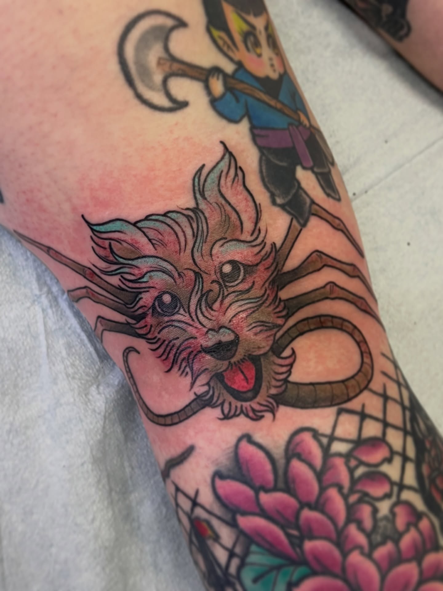 Lion and child American traditional tattoo on the forearm by Lacey B, Portland, Oregon