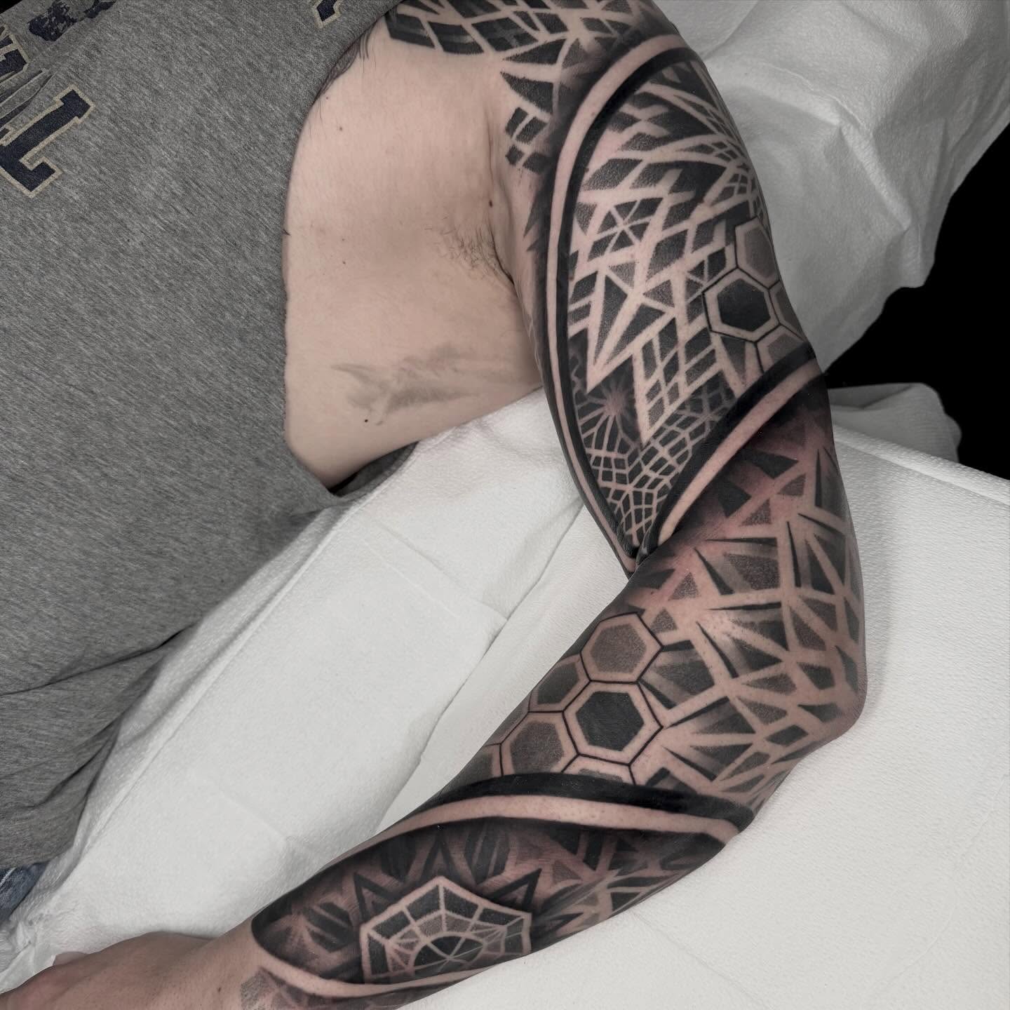 Geometric pattern geometric tattoo on the forearm by Kevin Johnson