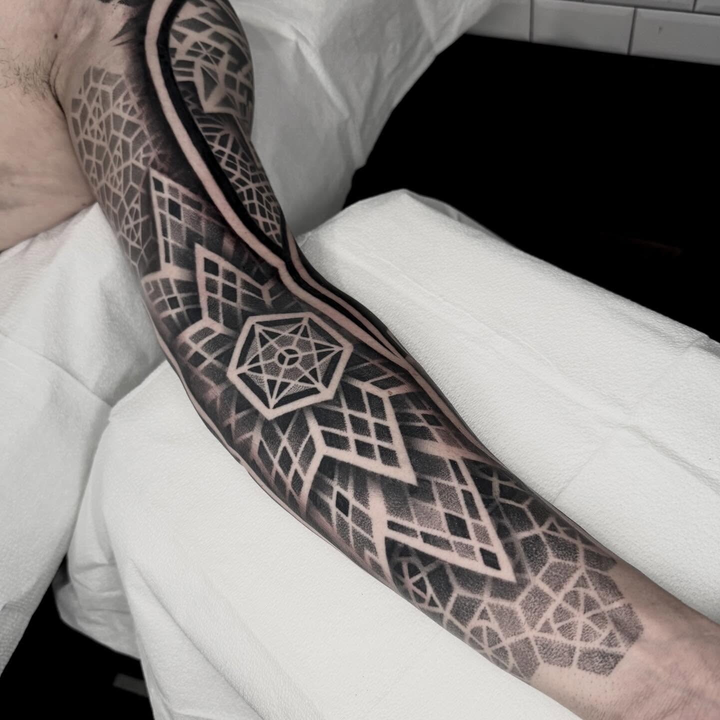 Geometric pattern geometric tattoo on the forearm by Kevin Johnson