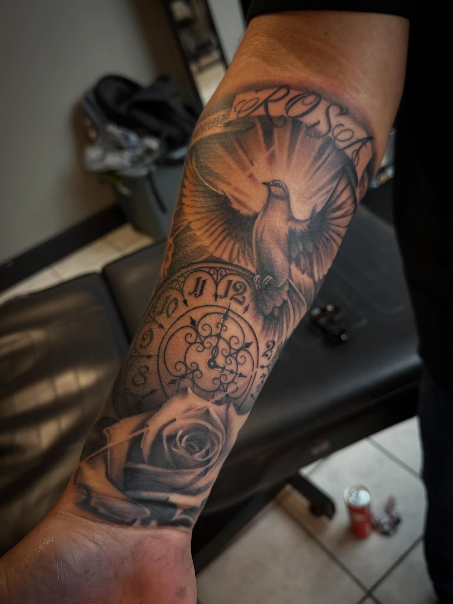 Clock and dove realism tattoo on the forearm by Jorge Hernandez