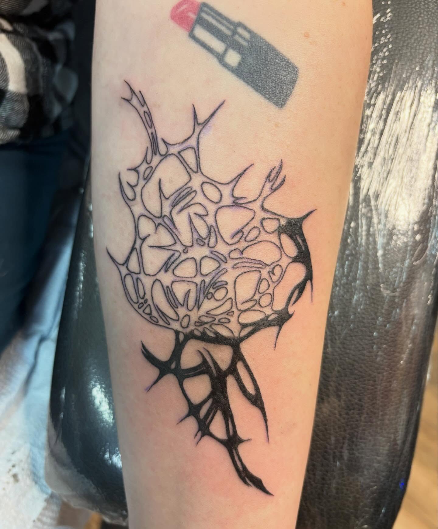 Thorn crown geometric tattoo on the forearm by izzy solae