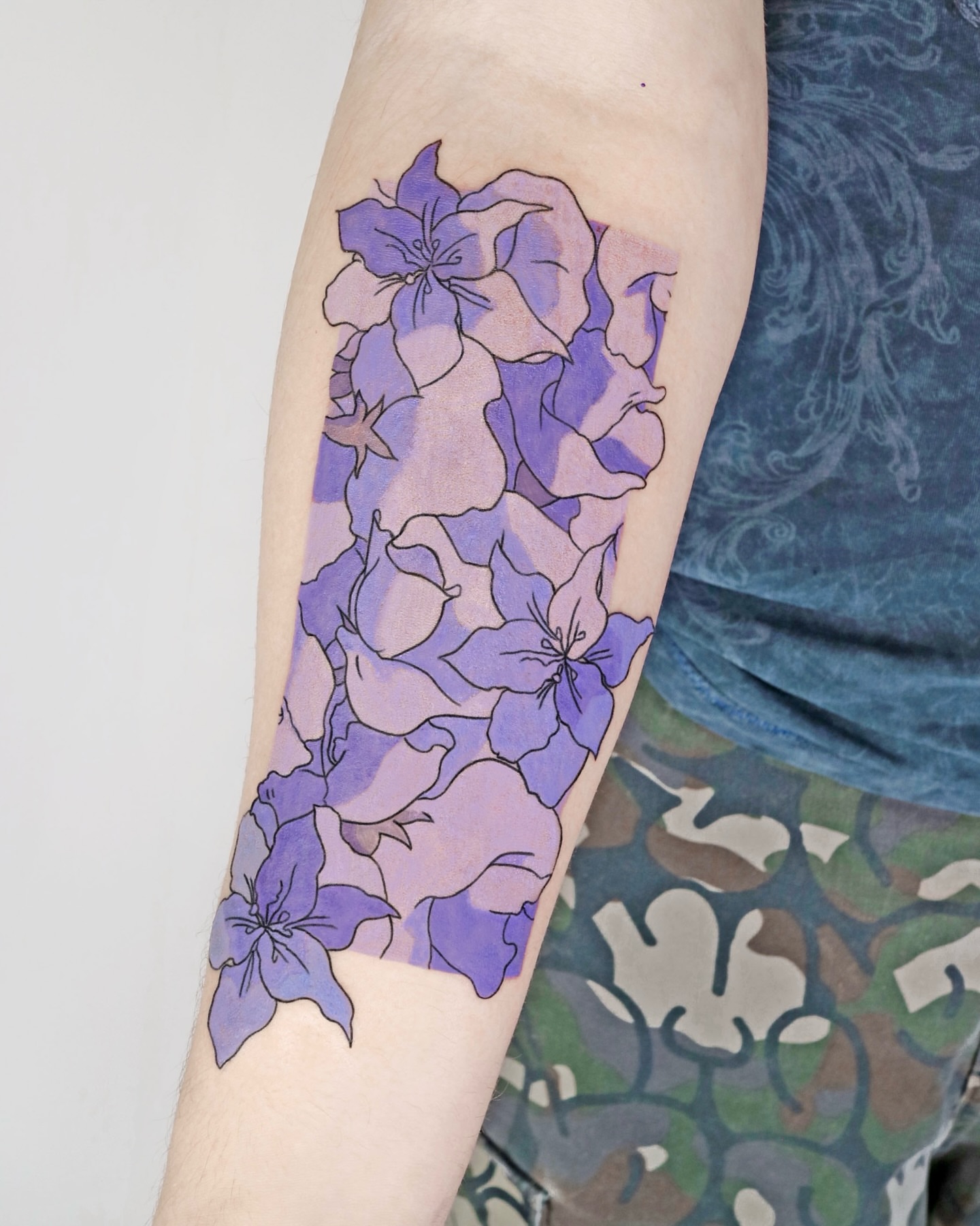 Purple flowers dotwork tattoo on the forearm by Aroha