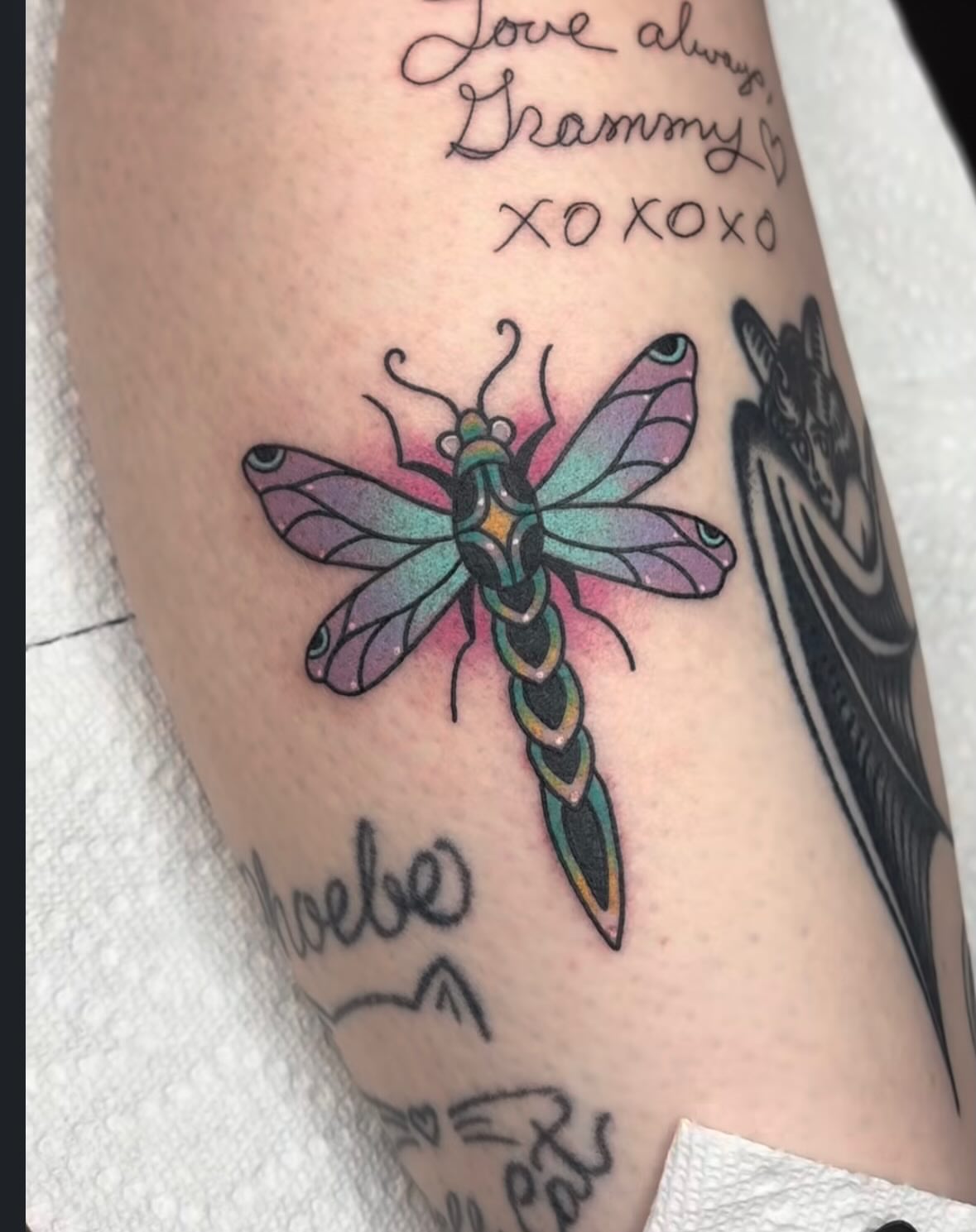 Dragonfly new school tattoo on the forearm by Malia Clark