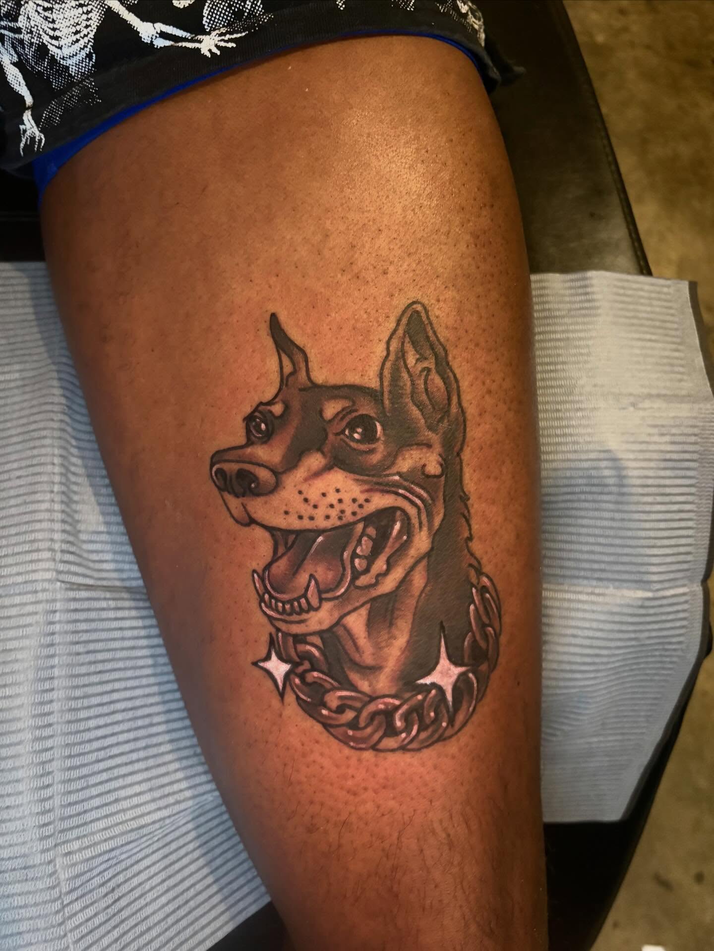 Dog with chain realism tattoo on the thigh by Mim