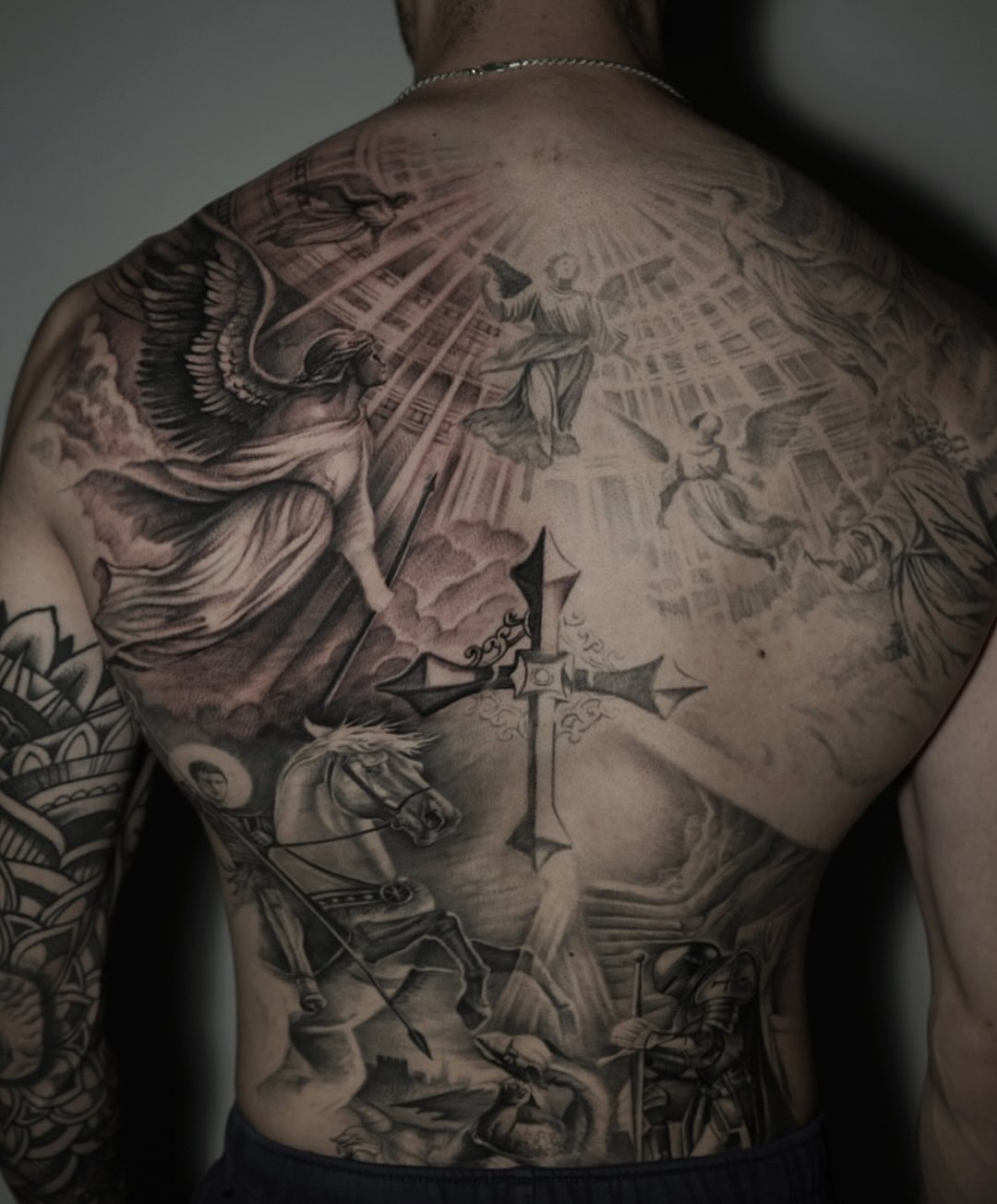Religious battle scene realism tattoo on the back by Sabrina Lakhaysy, Fort Worth, Texas